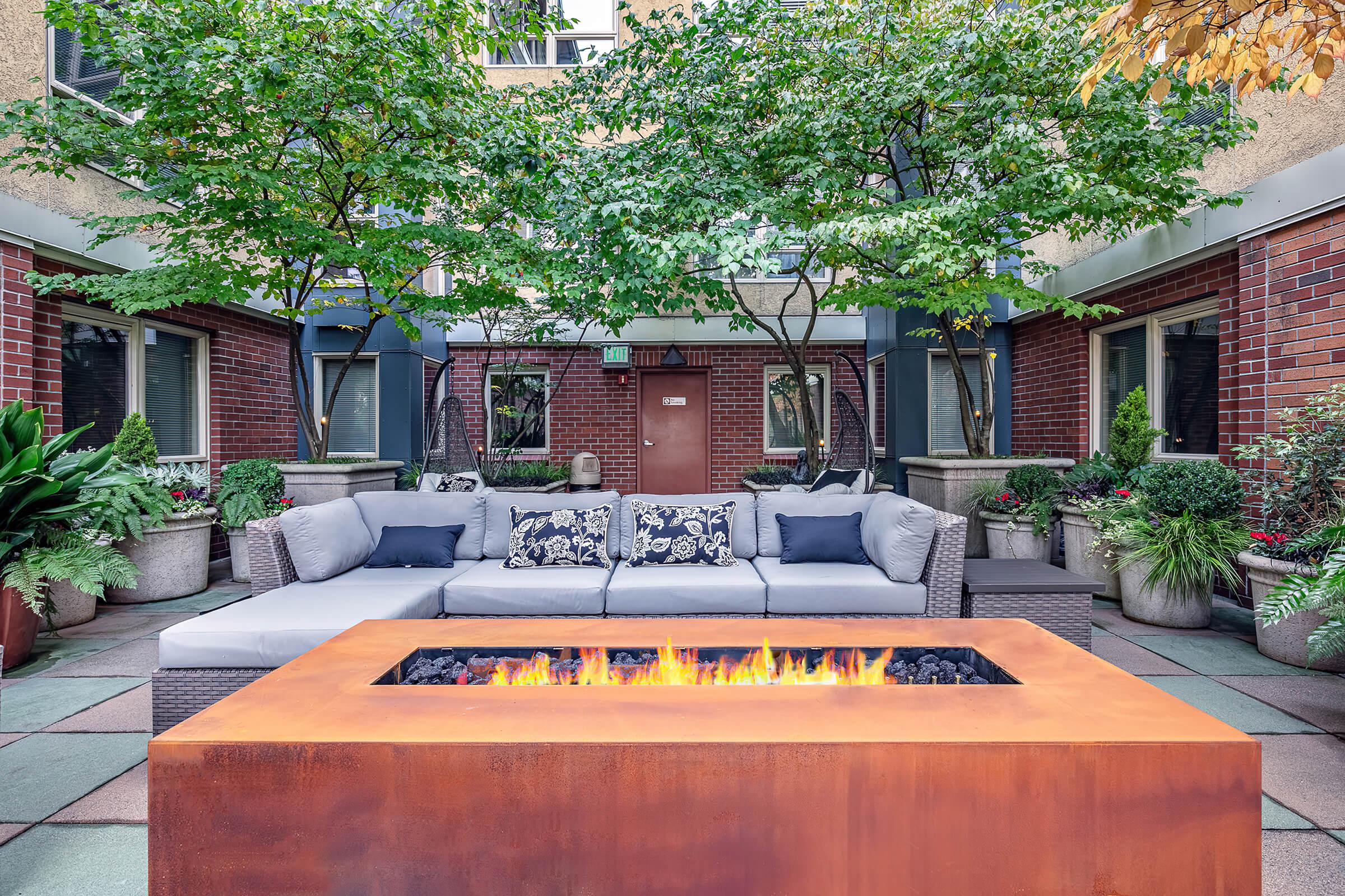 a bench in front of a brick building