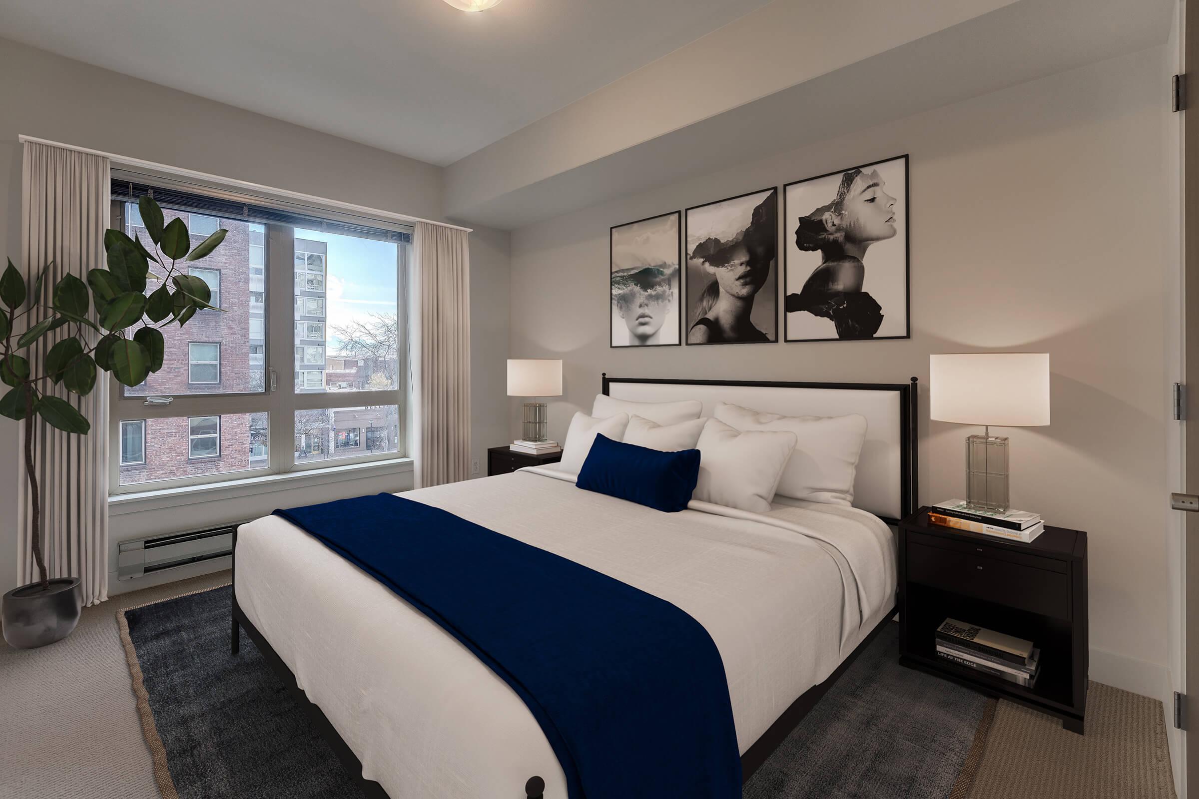 a bedroom with a large bed in a hotel room