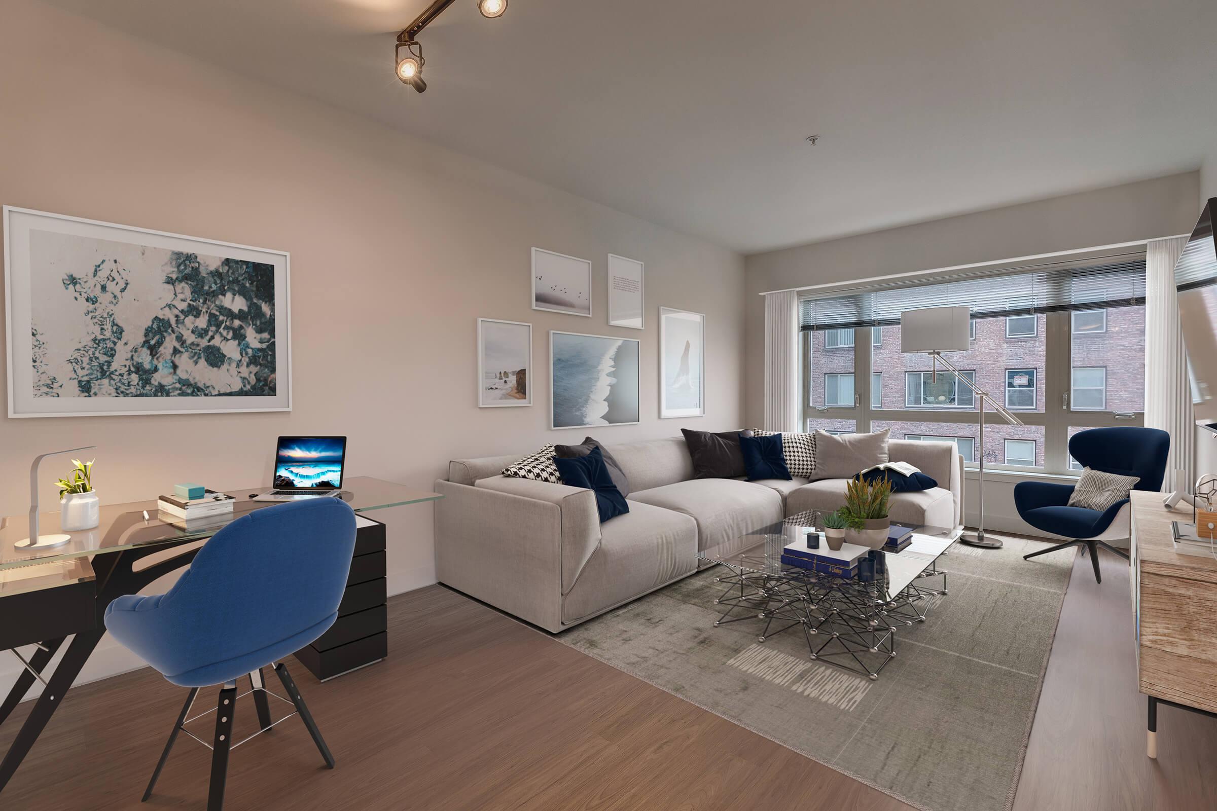 a living room filled with furniture and a large window