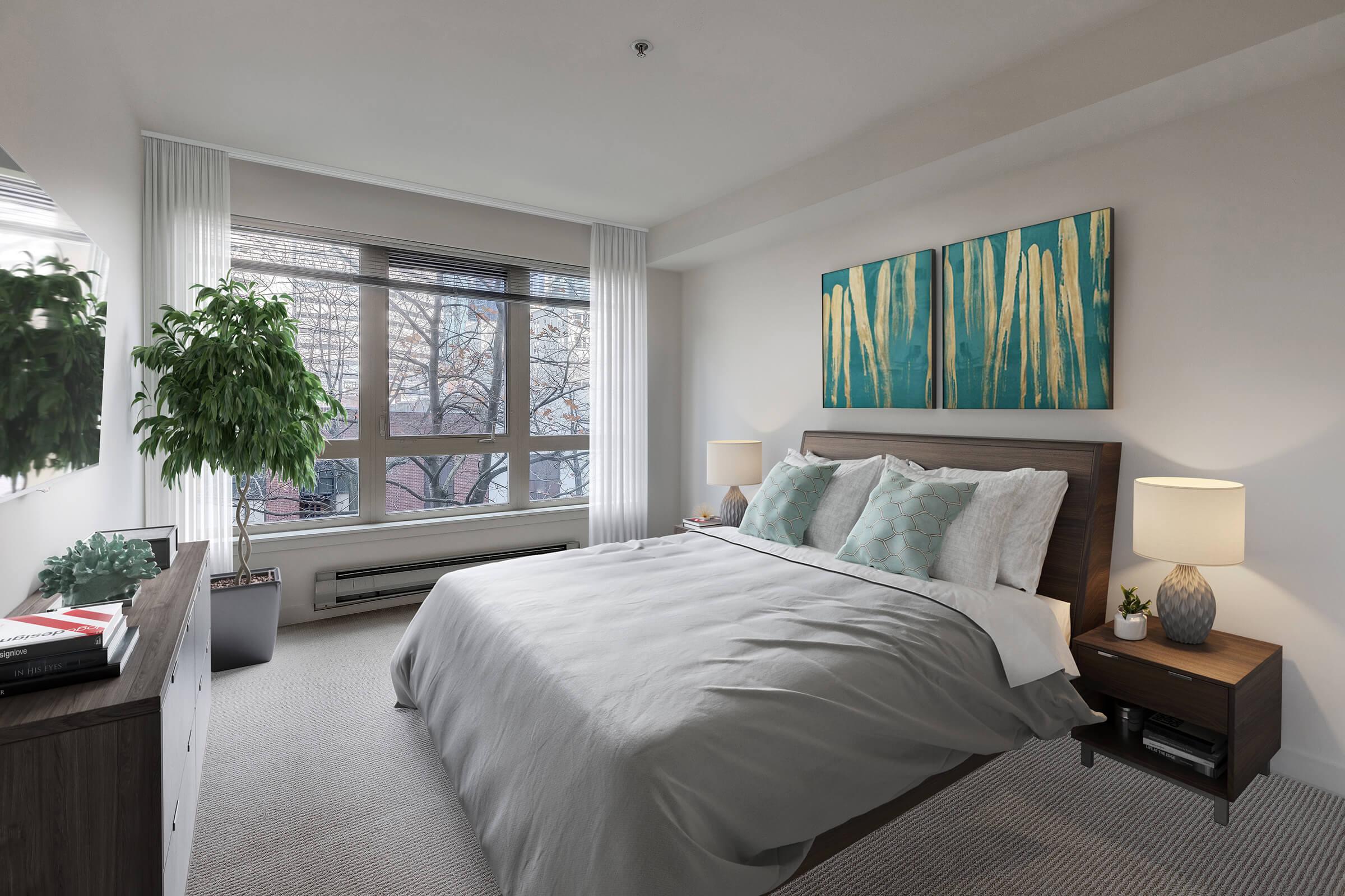 a bedroom with a large bed in a hotel room