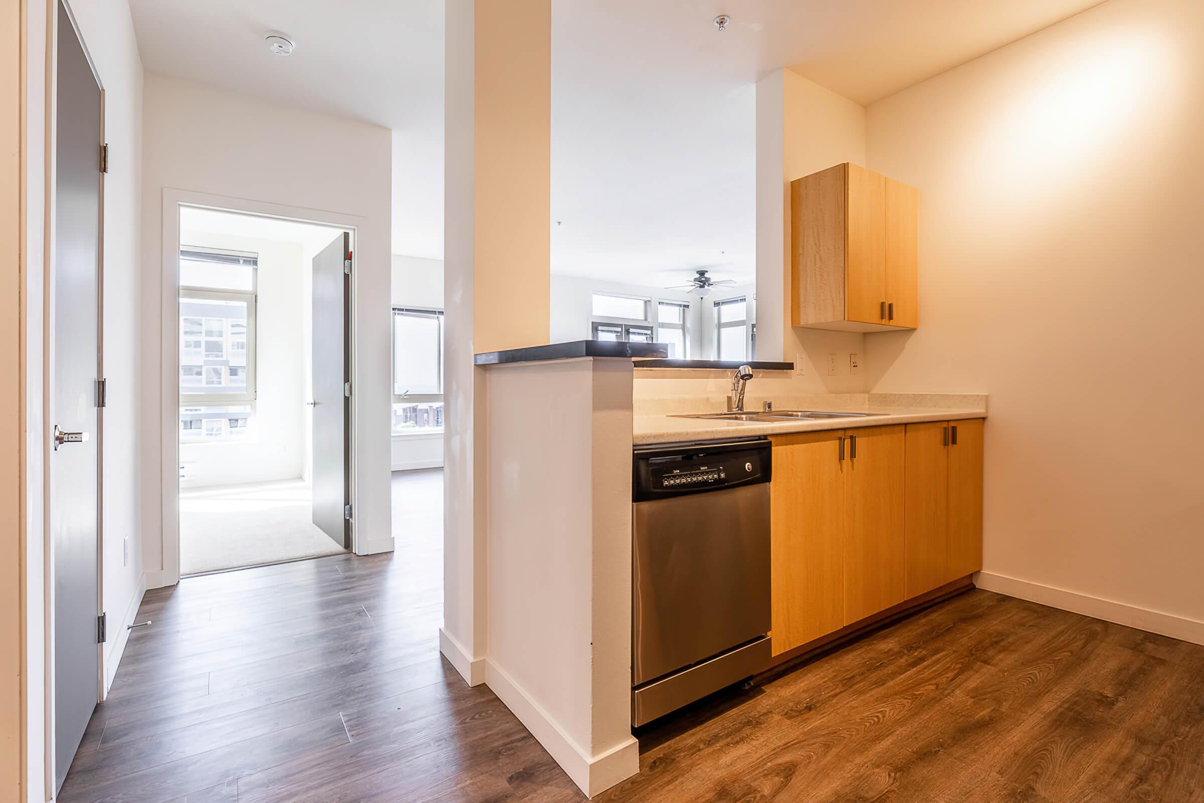 a kitchen with a wood floor