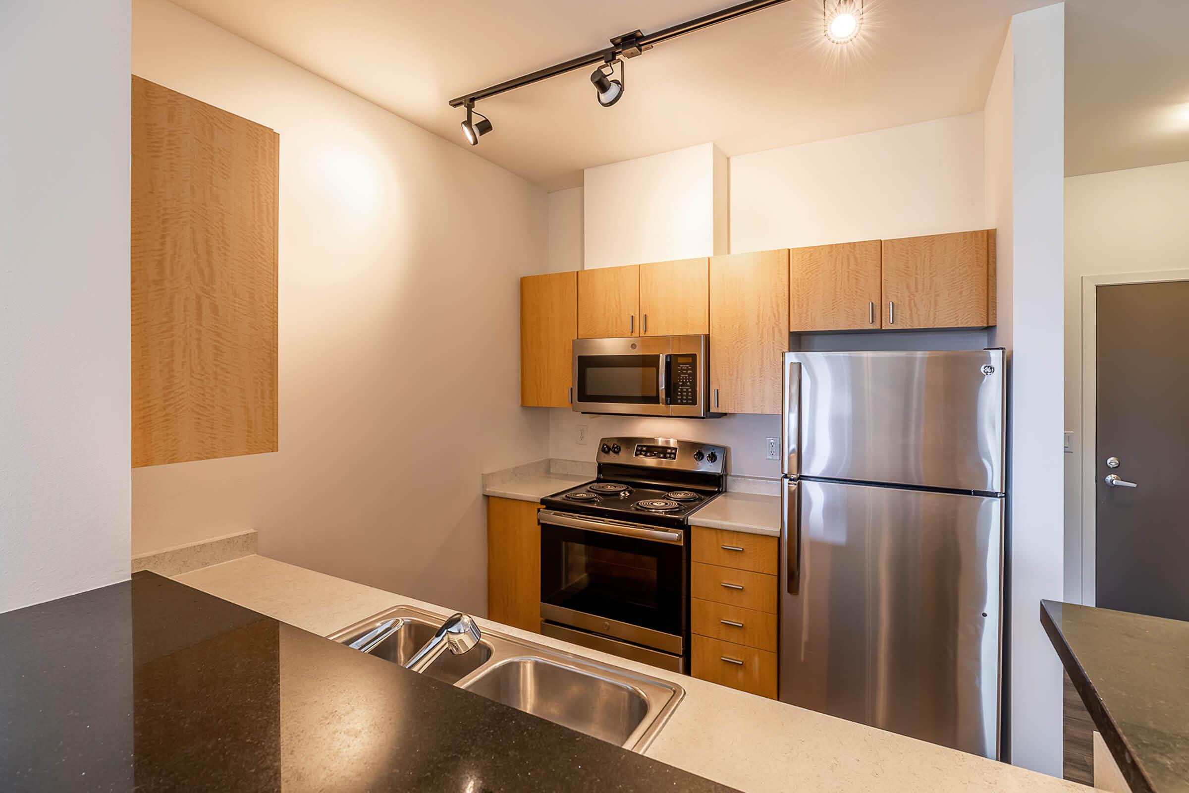 a modern kitchen with stainless steel appliances