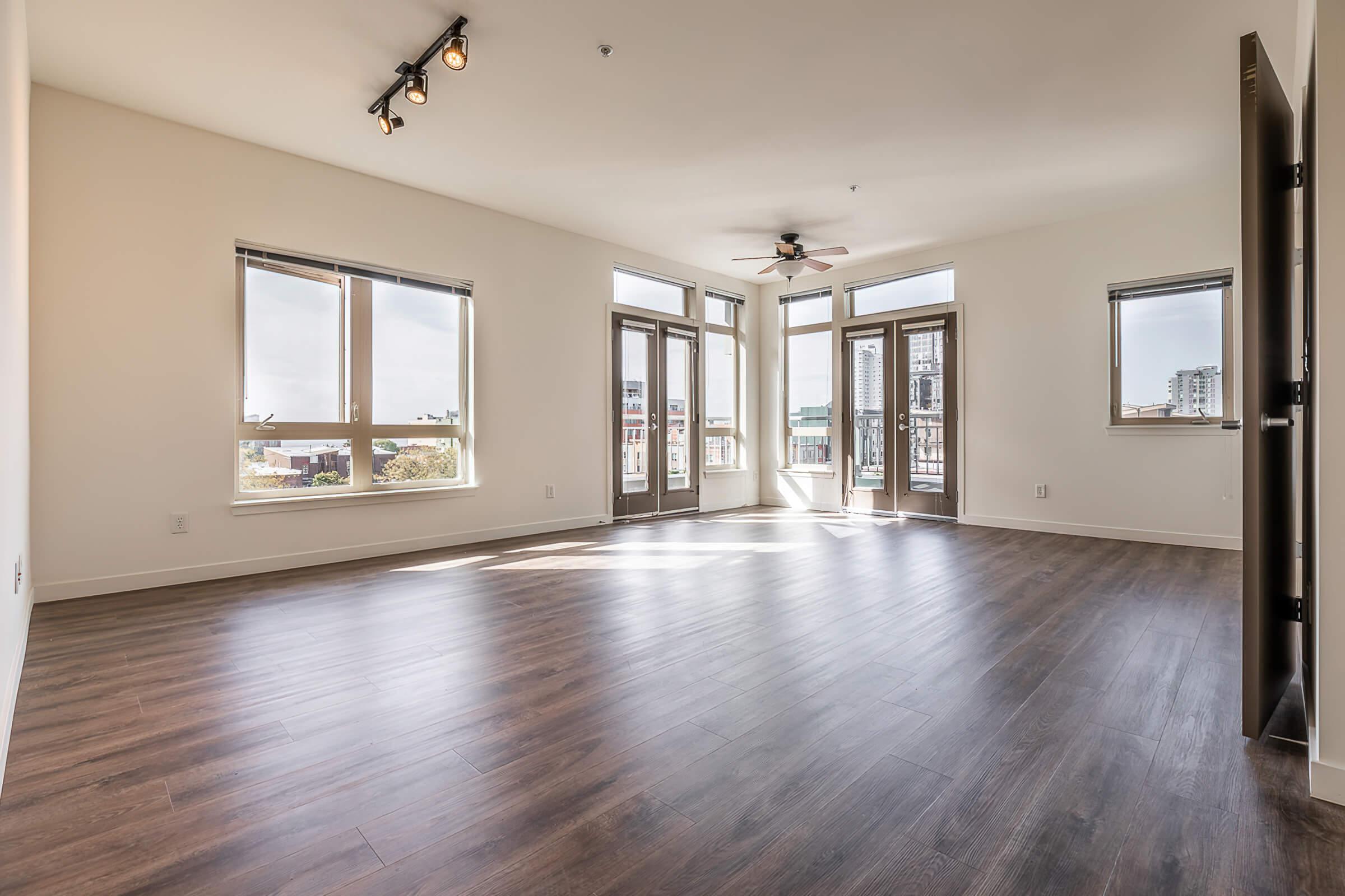 a large empty room with a wood floor