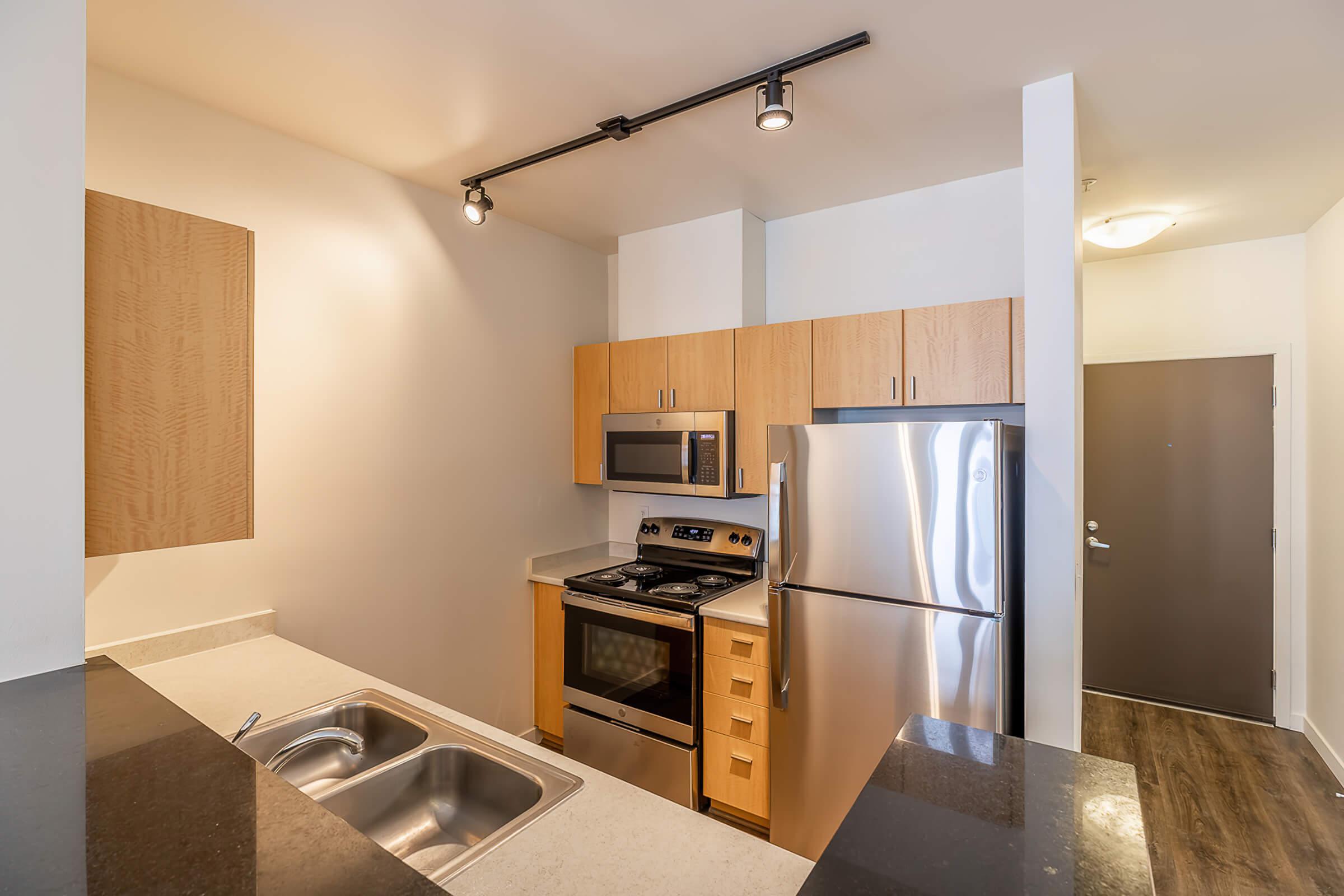 a kitchen with a stove top oven sitting inside of a refrigerator