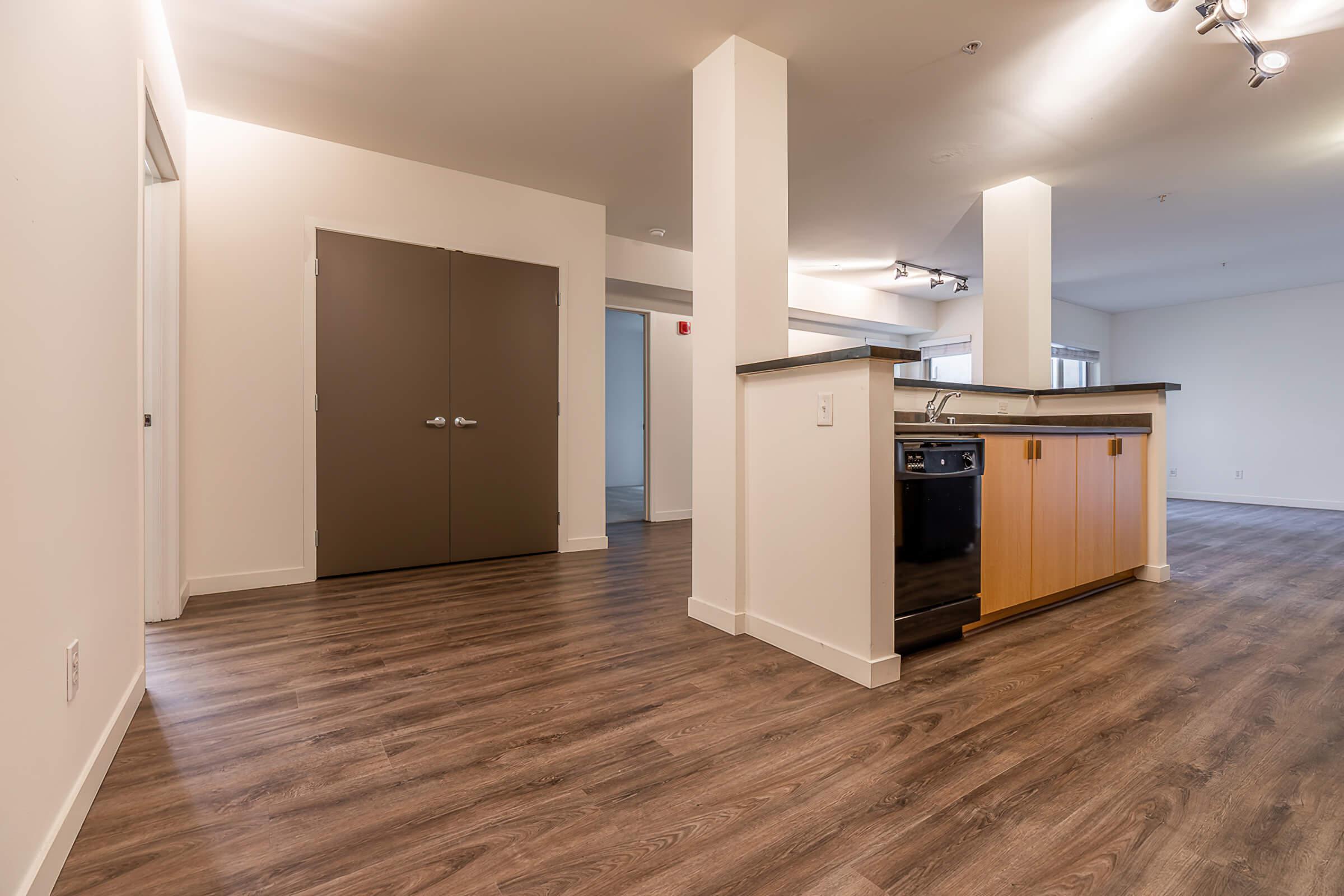 a kitchen with a wood floor