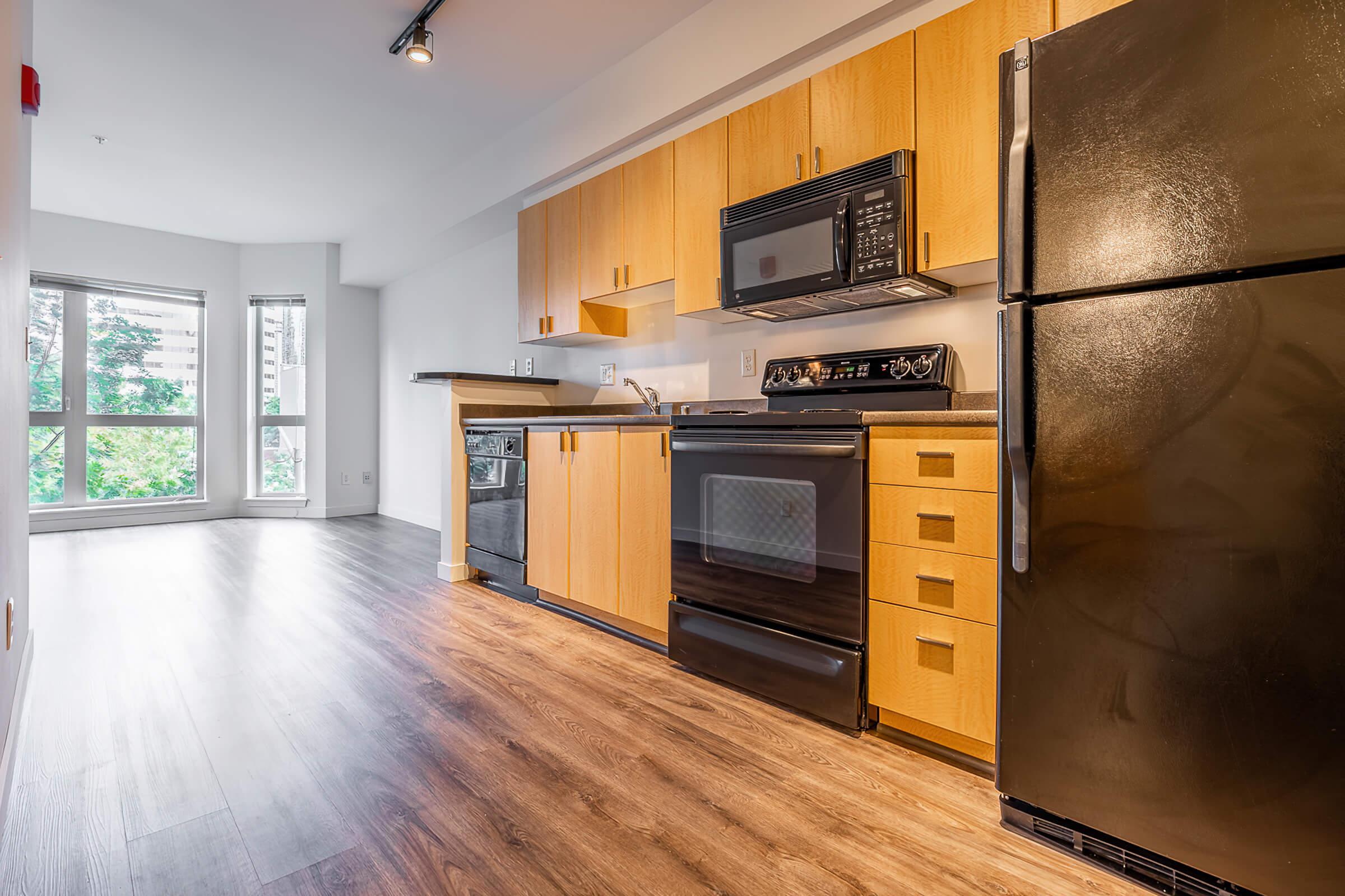 a large kitchen with stainless steel appliances