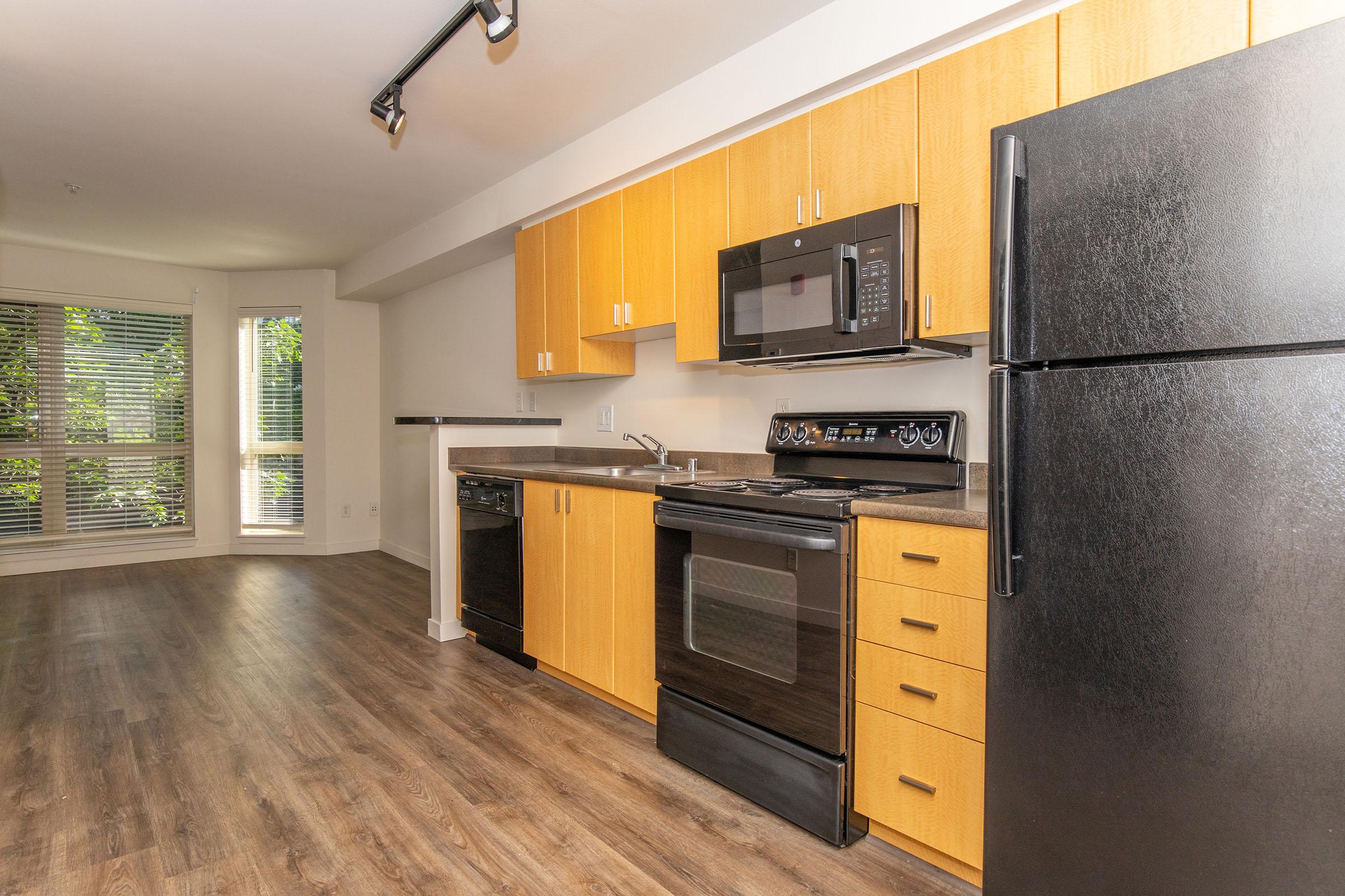 a large kitchen with stainless steel appliances