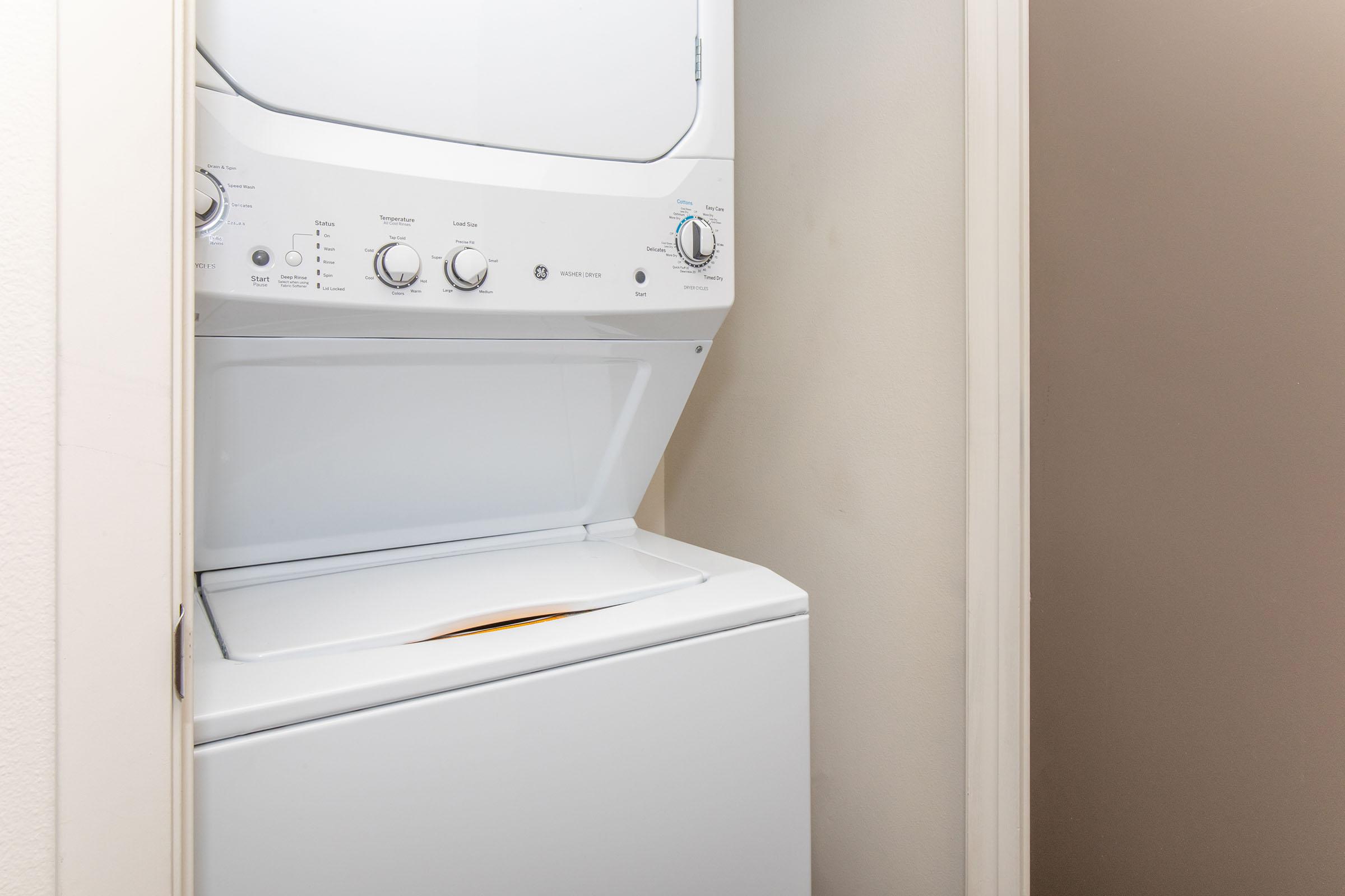 a microwave oven sitting on top of a refrigerator