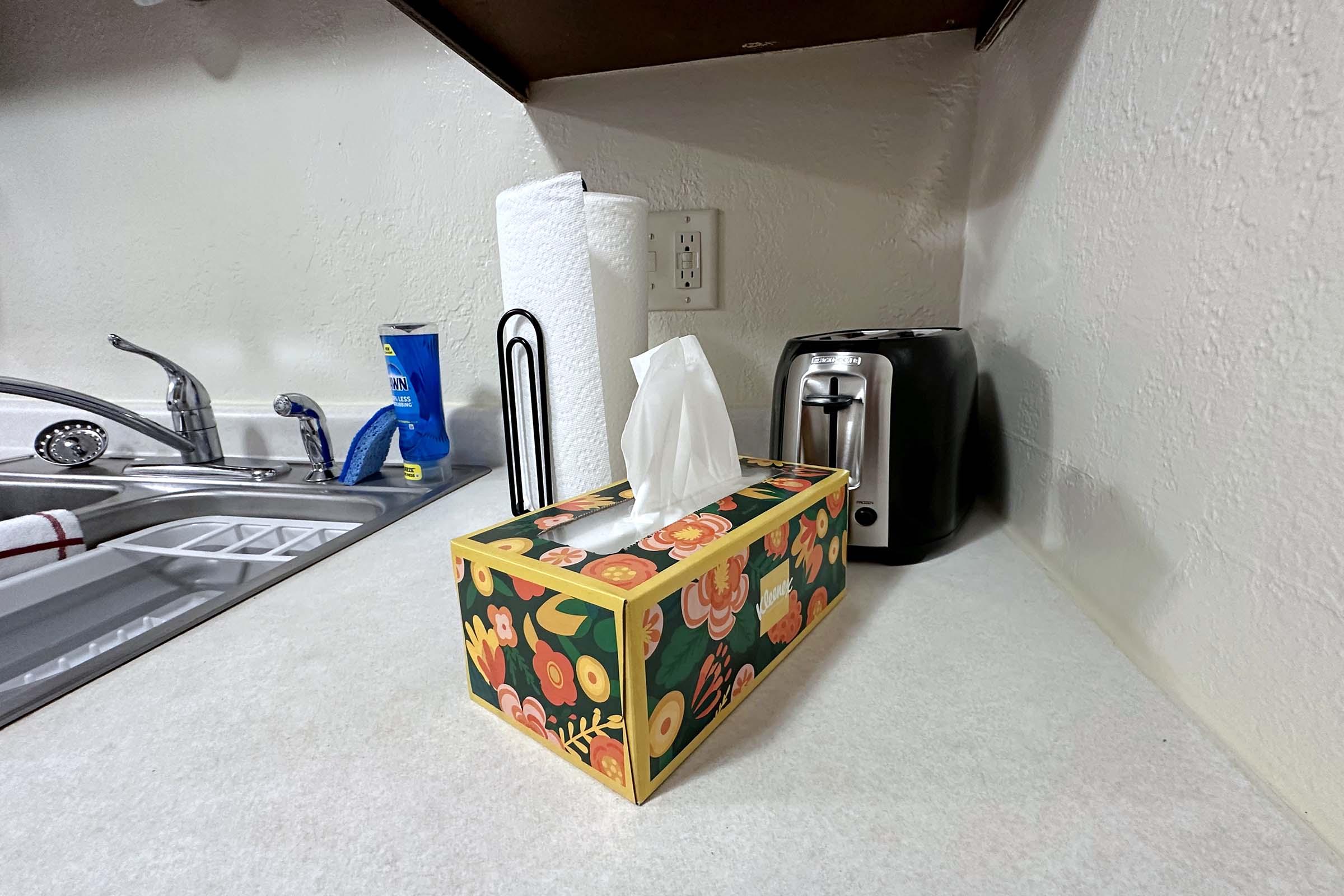 a kitchen with a sink and a refrigerator