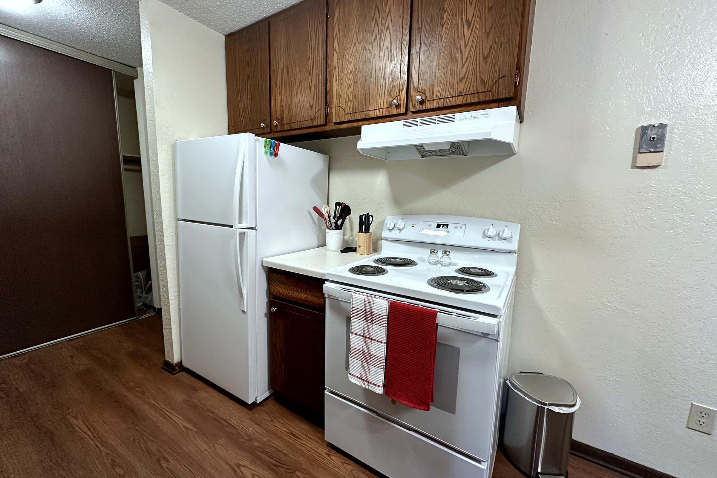 a kitchen with a stove top oven sitting inside of a refrigerator