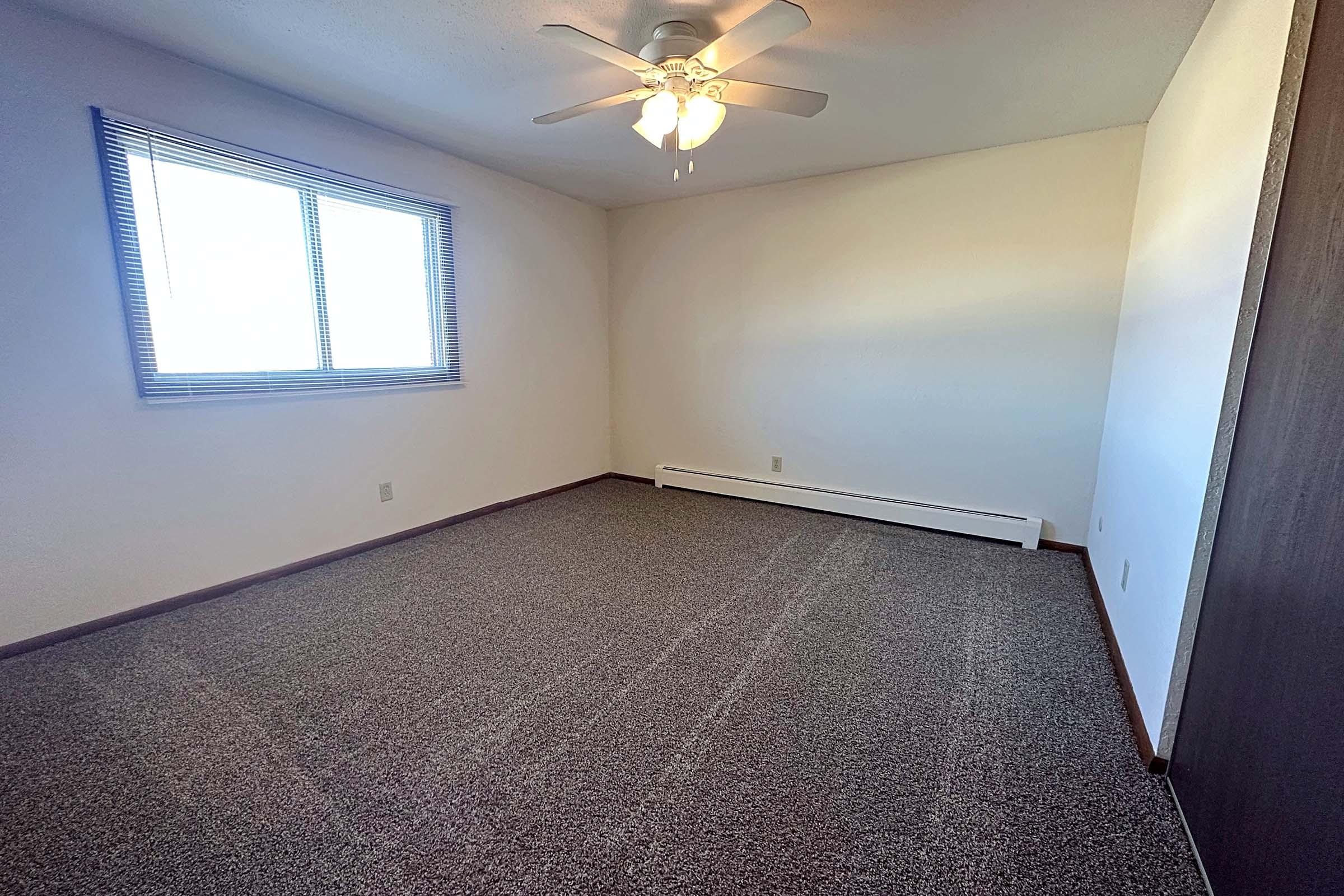 a bedroom with a large window