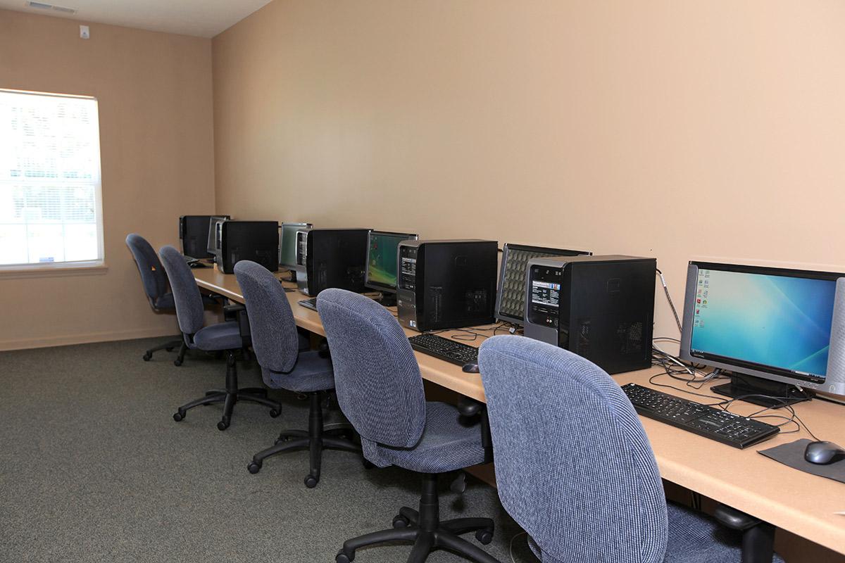 a desktop computer sitting on top of a chair