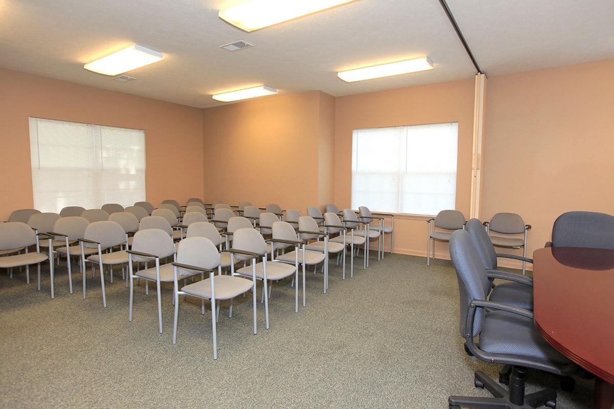 a room filled with furniture and a table