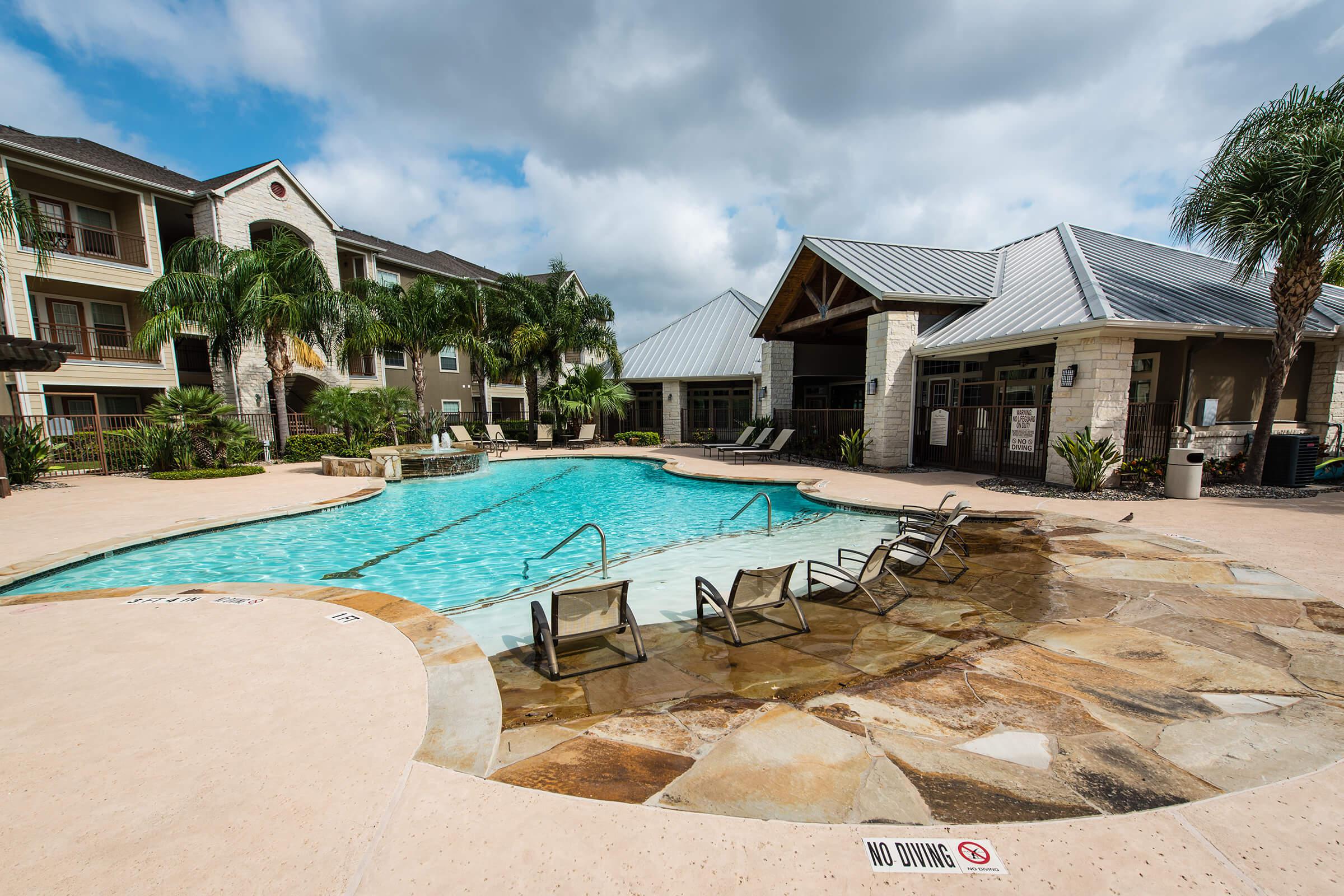 a house with a pool outside of a building