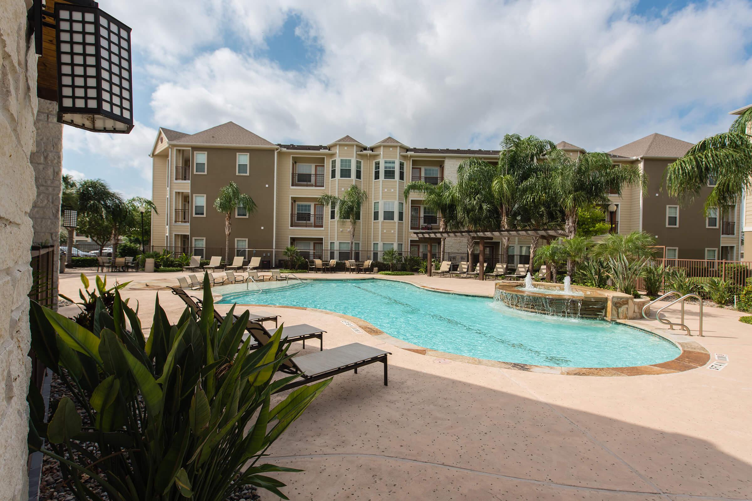 a large pool of water in front of a building