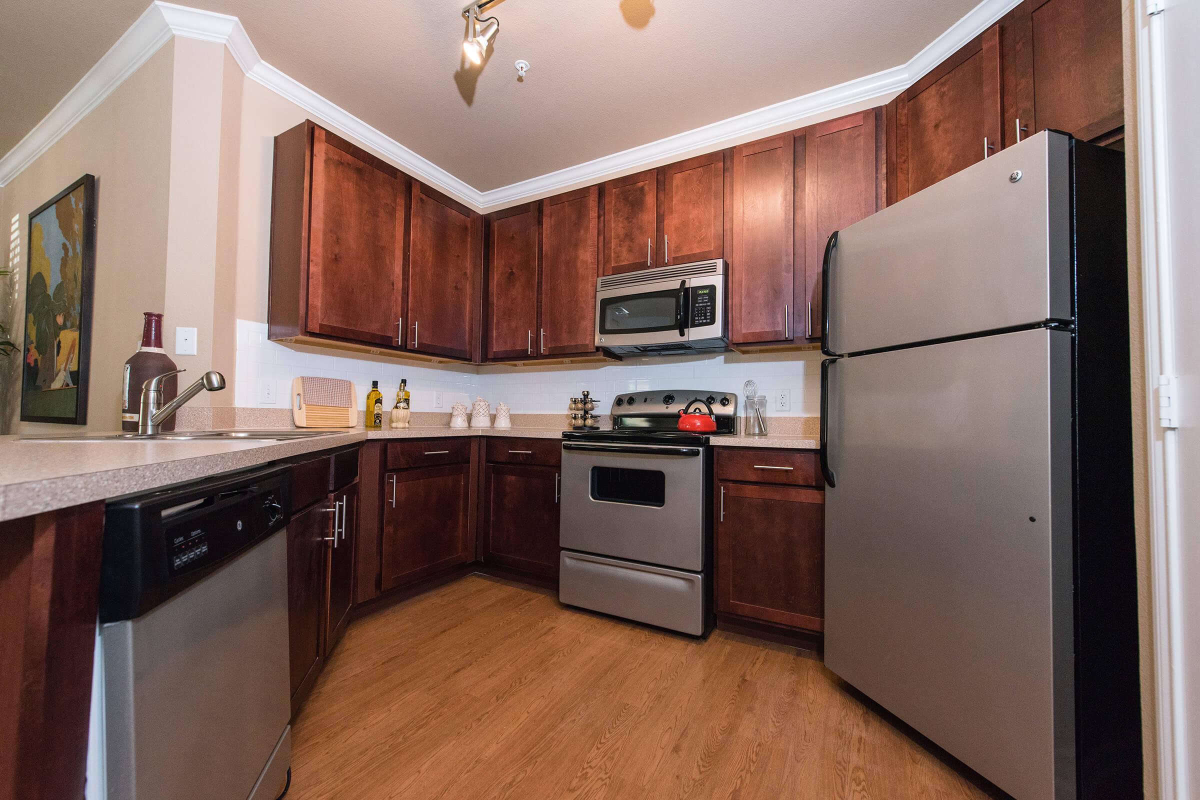 a kitchen with a stove top oven sitting inside of a refrigerator