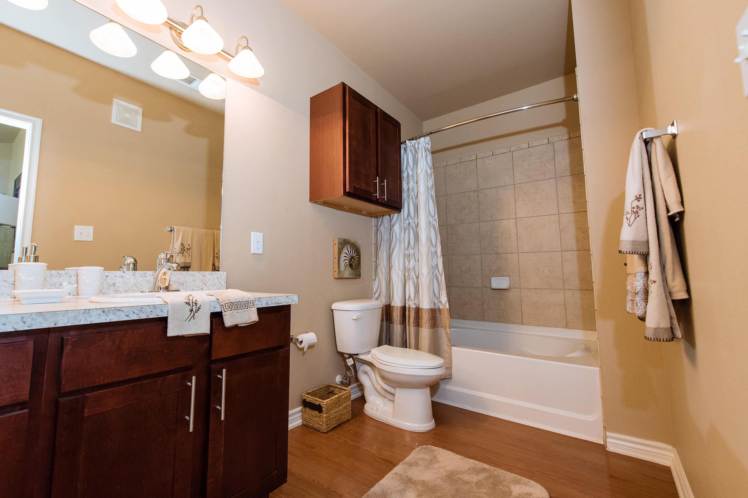 a room with a sink and a mirror