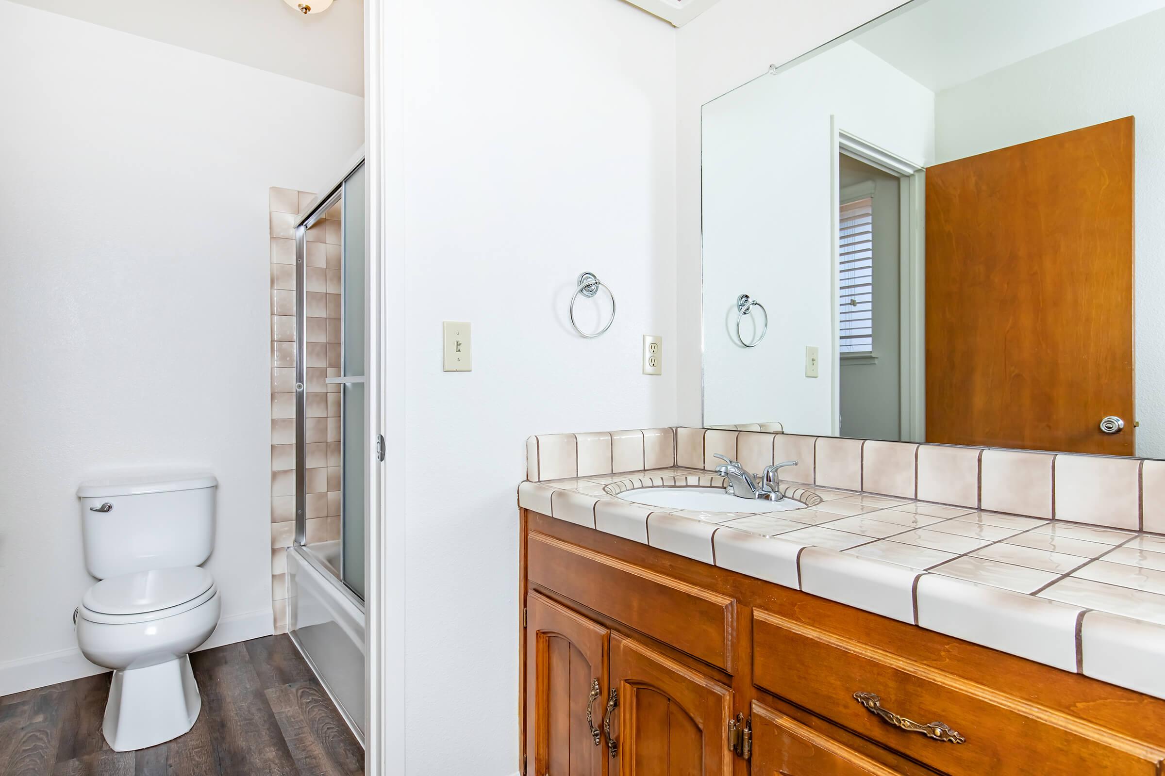 a kitchen with a sink and a mirror