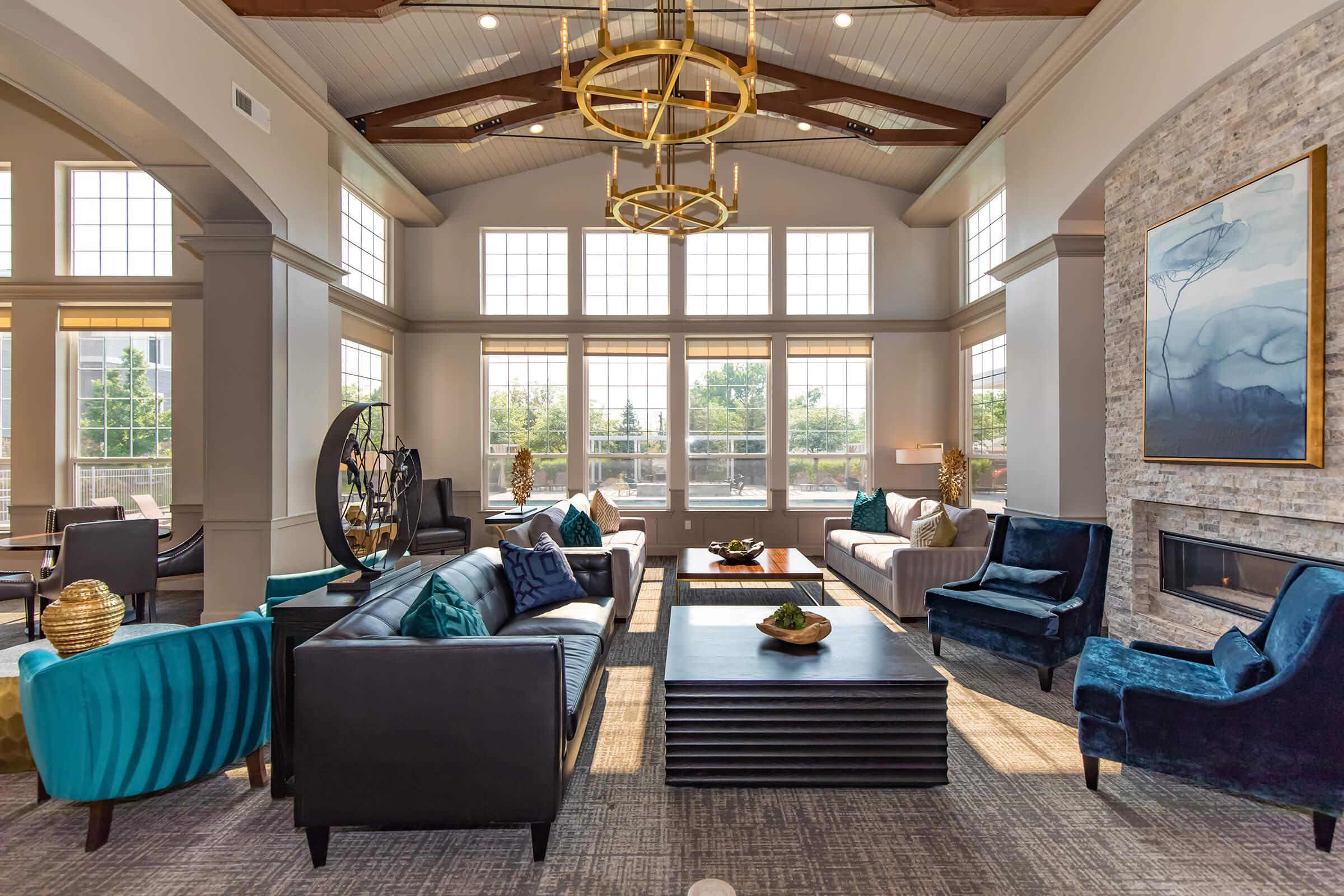 a living room filled with furniture and a large window