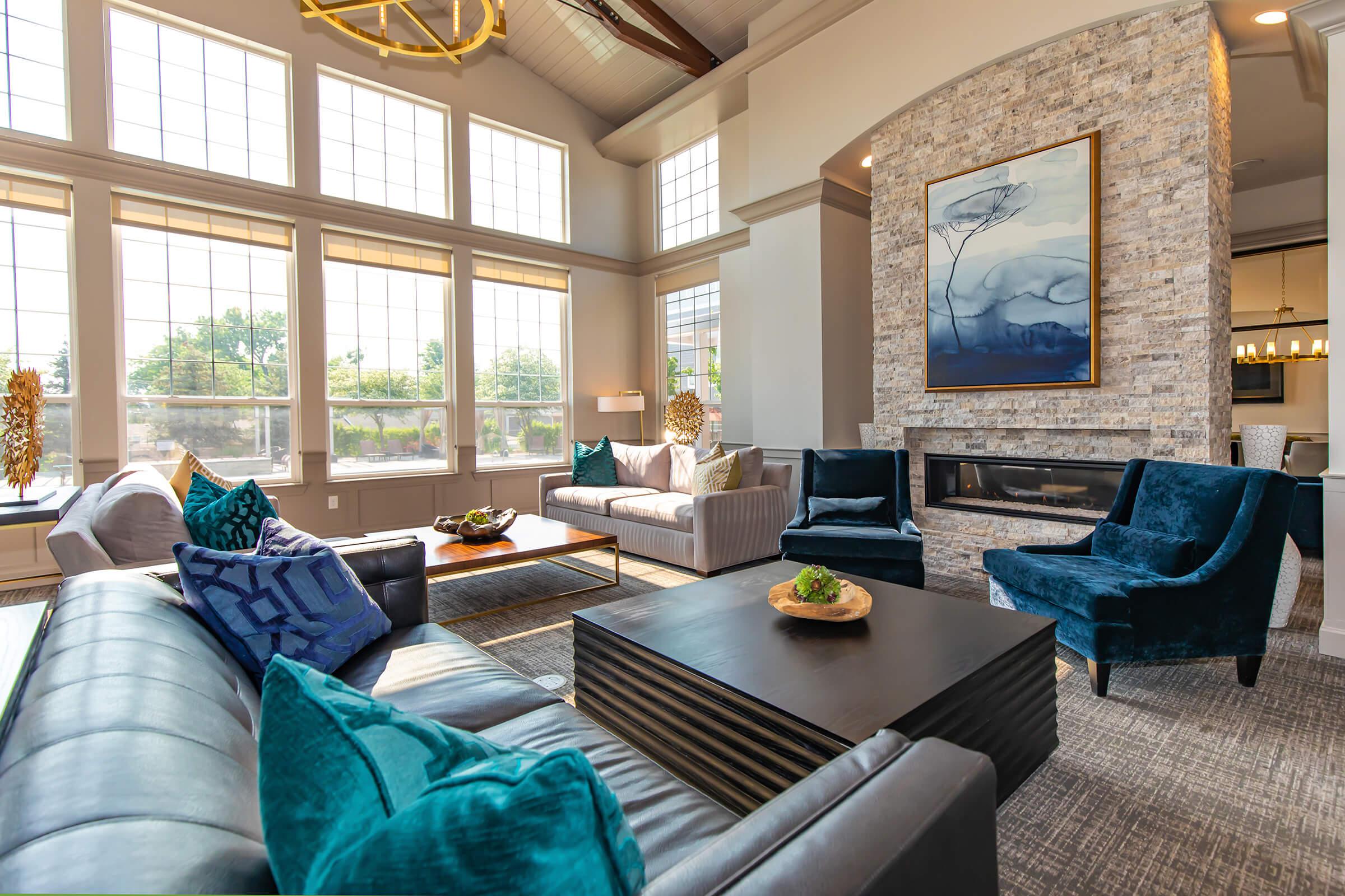 a living room filled with furniture and a large window