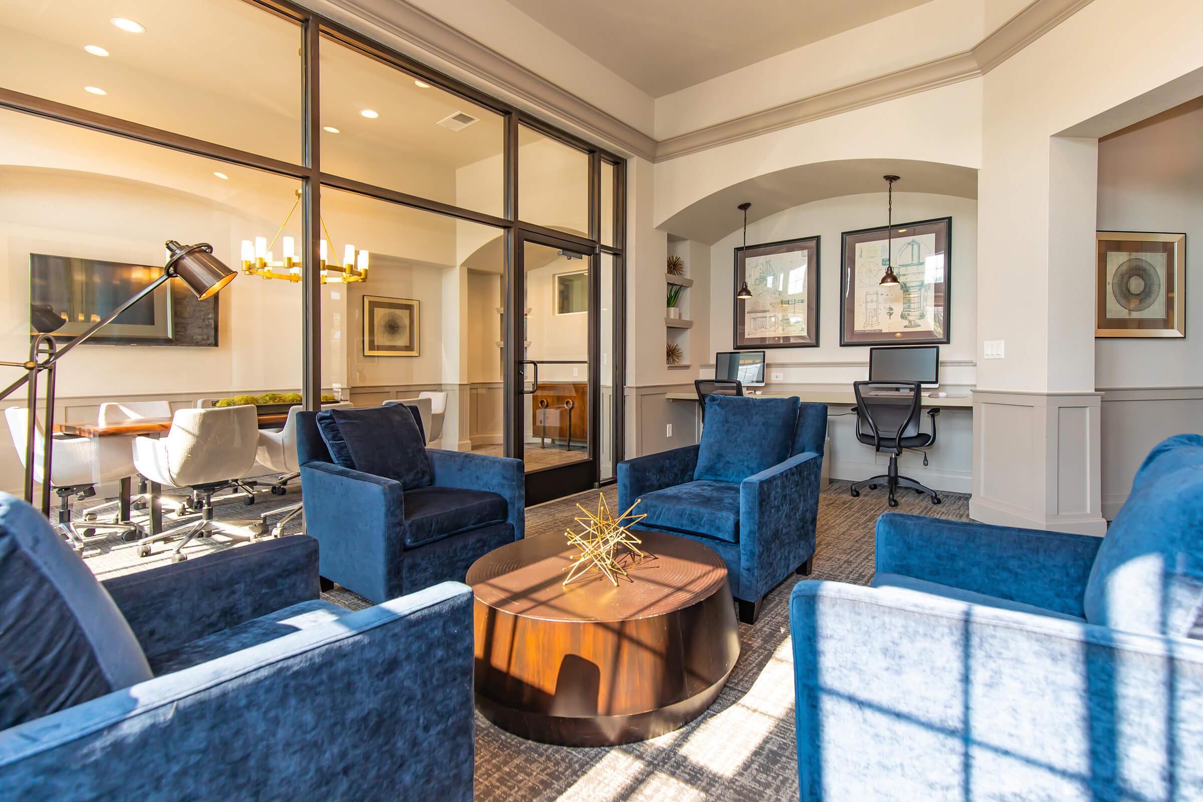 a room filled with furniture and a blue chair