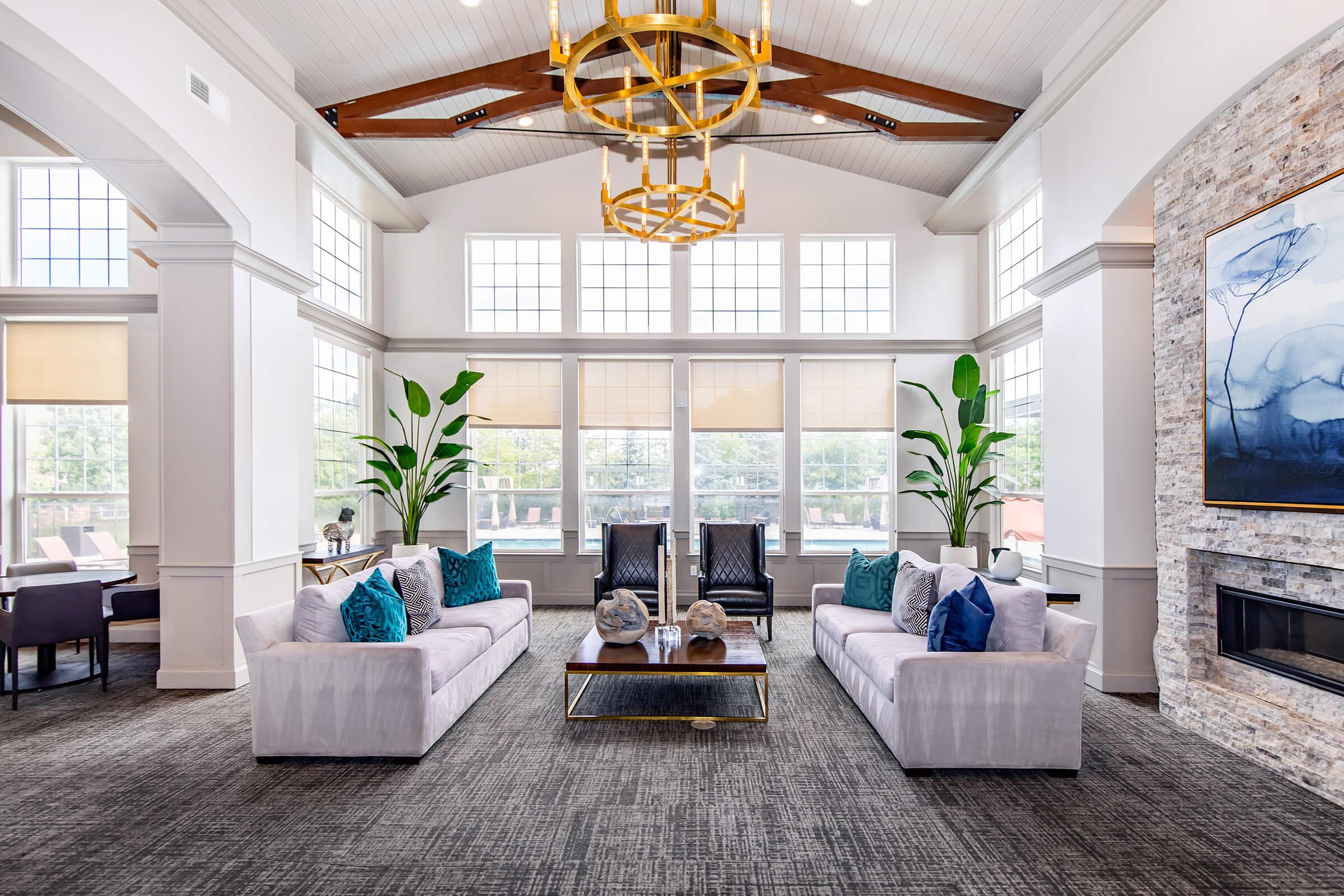 a living room filled with furniture and a large window