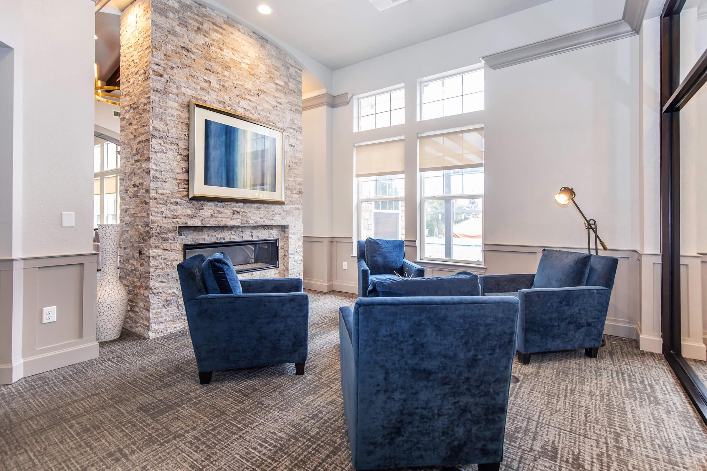 a living room filled with furniture and a large window