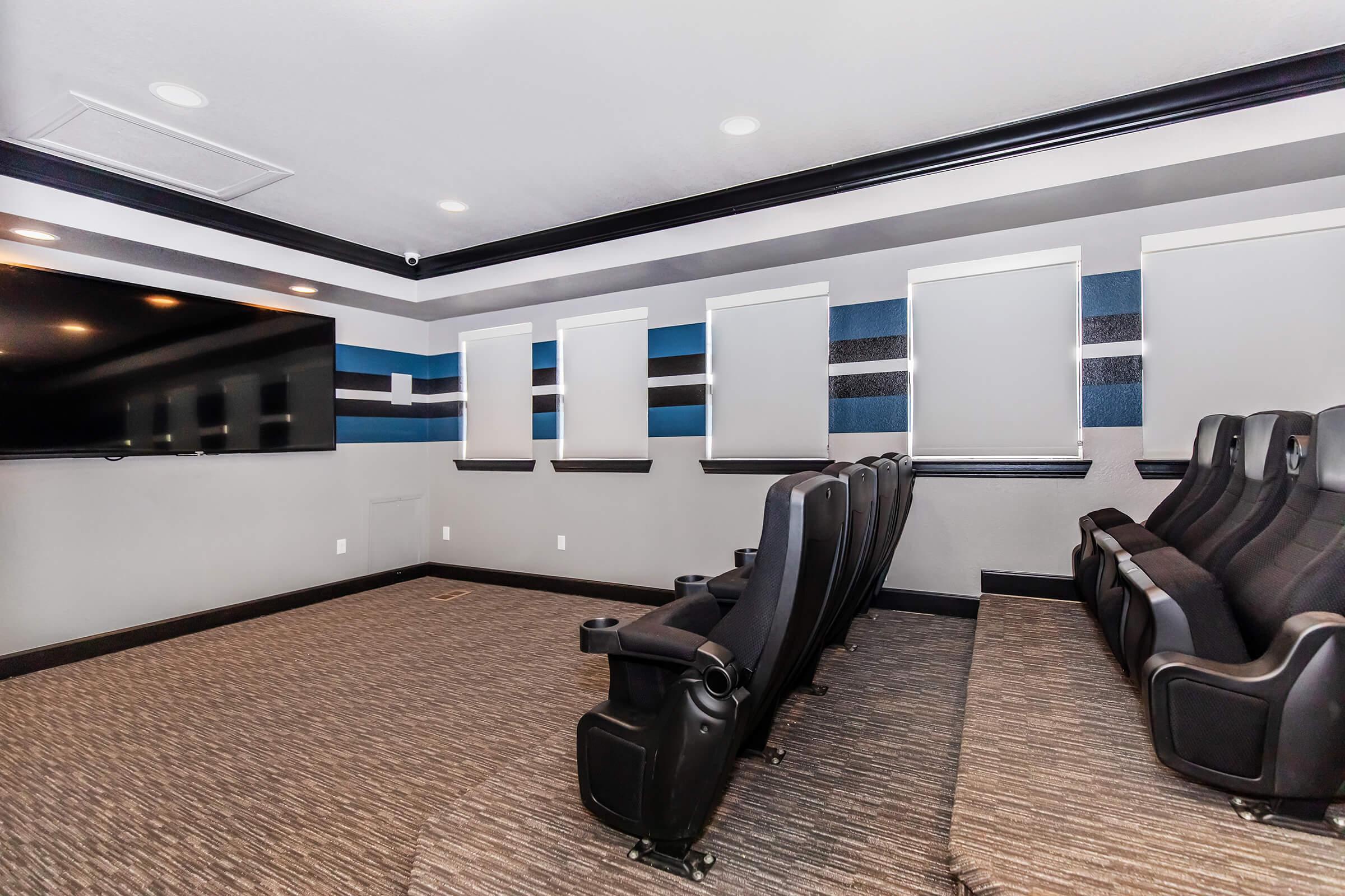 a living room filled with furniture and a flat screen tv