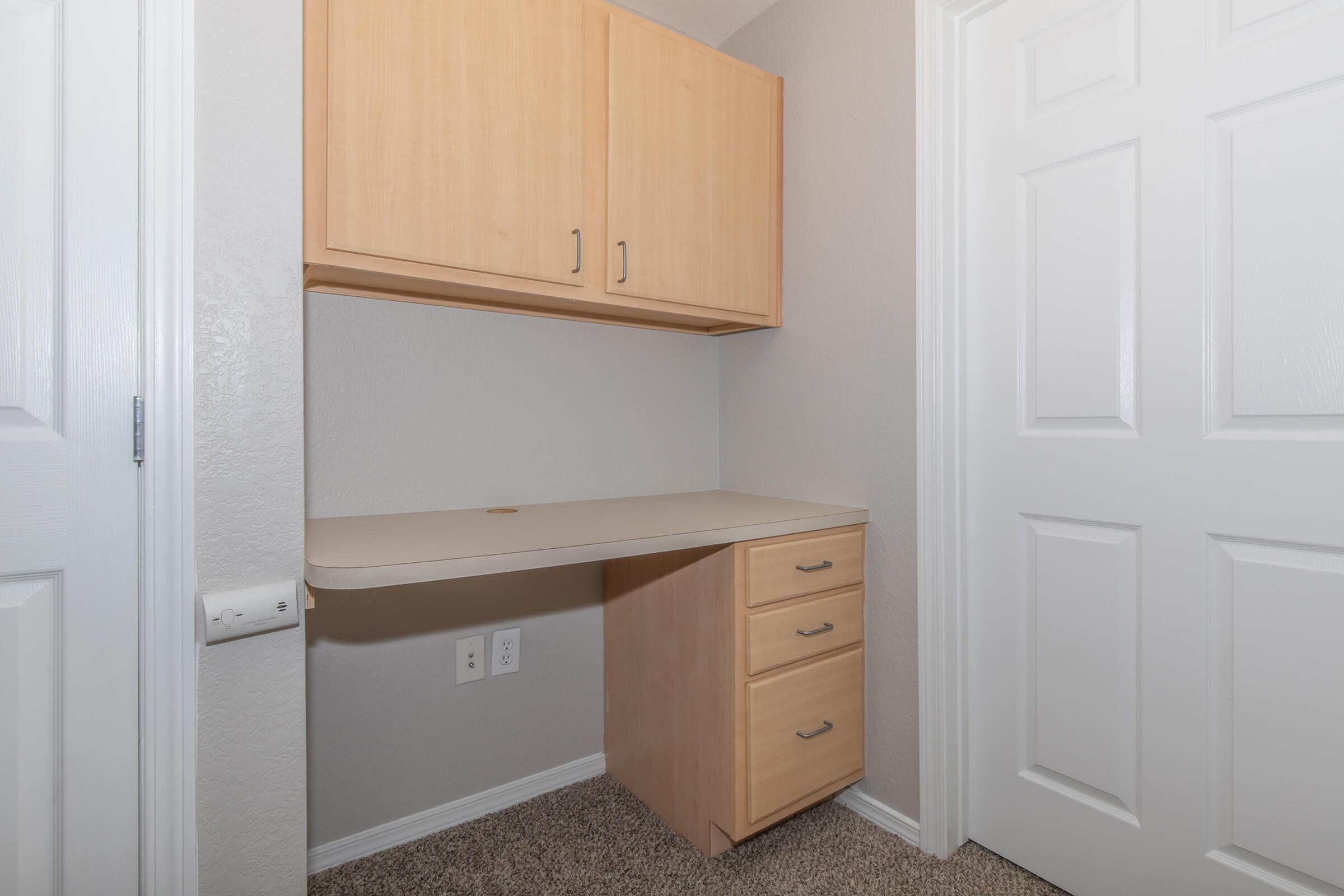 a kitchen with a sink and a refrigerator