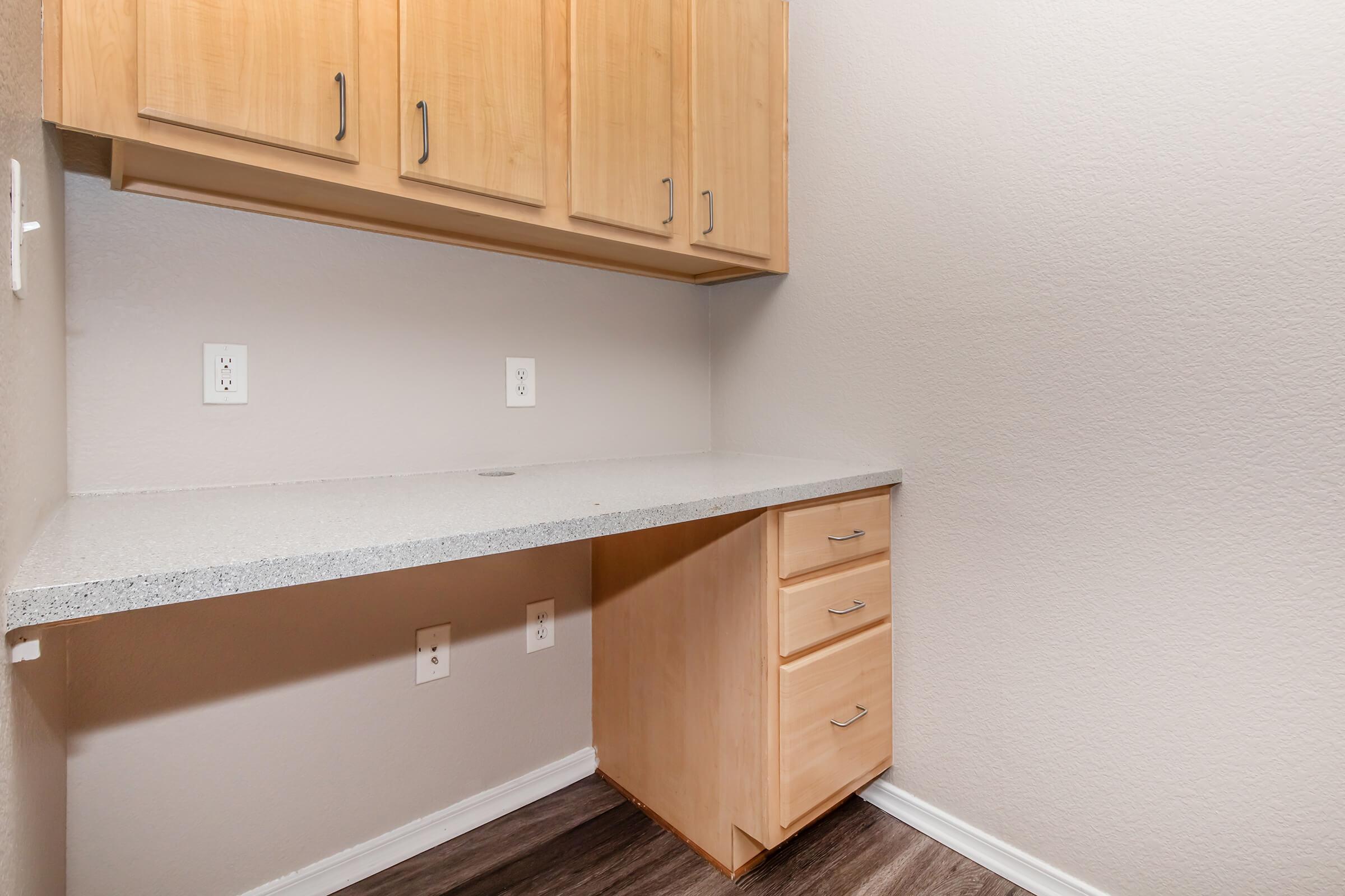 a kitchen with wooden cabinets and a sink