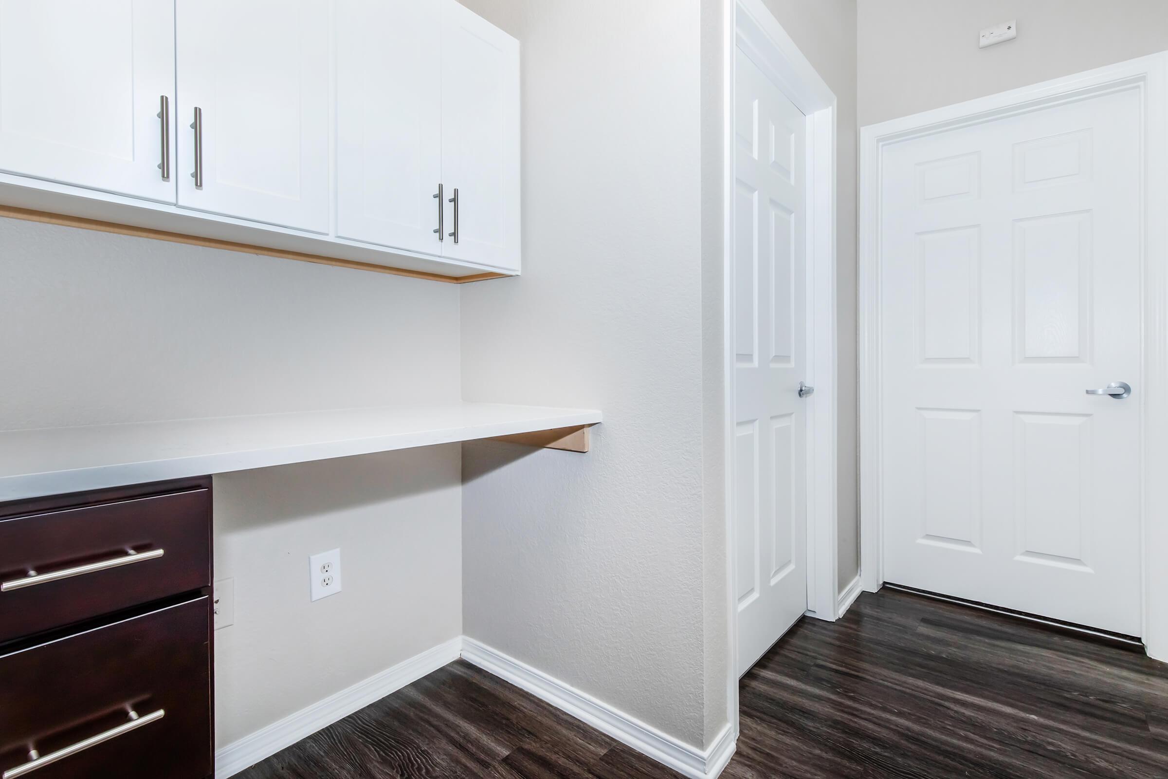 a kitchen with a sink and a mirror