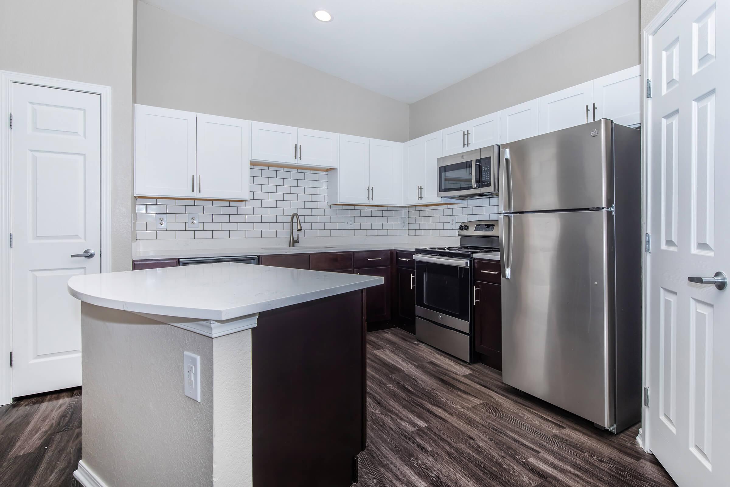 a stainless steel refrigerator in a kitchen