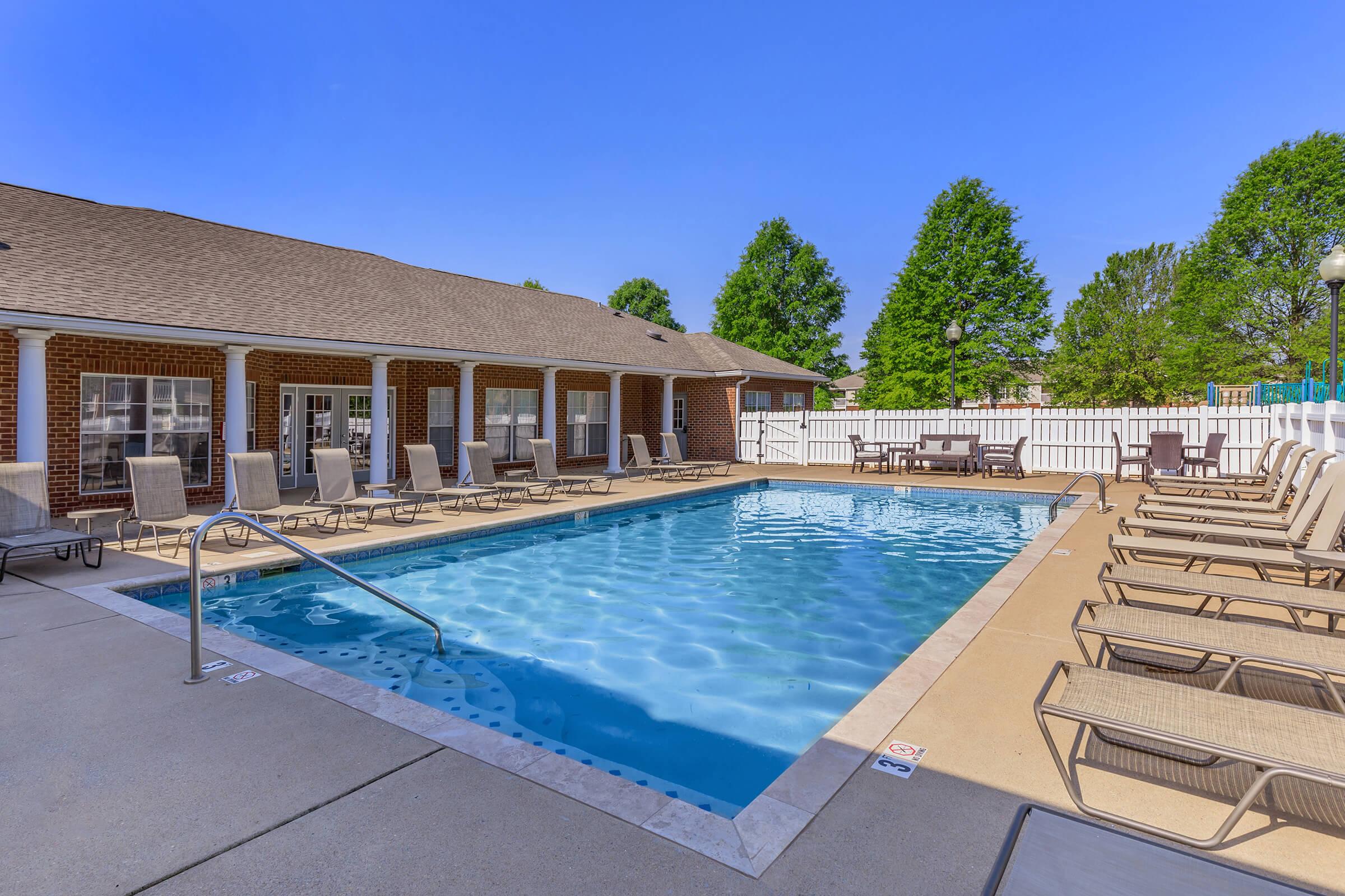 swimming pool and deck chairs