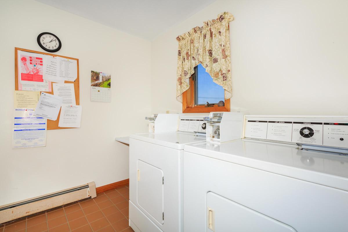 a kitchen with white cabinets