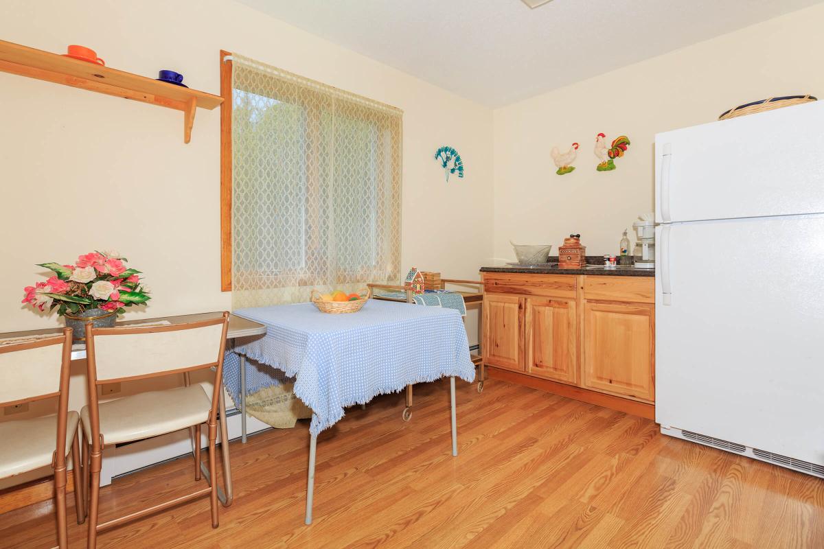 a kitchen with a wooden floor