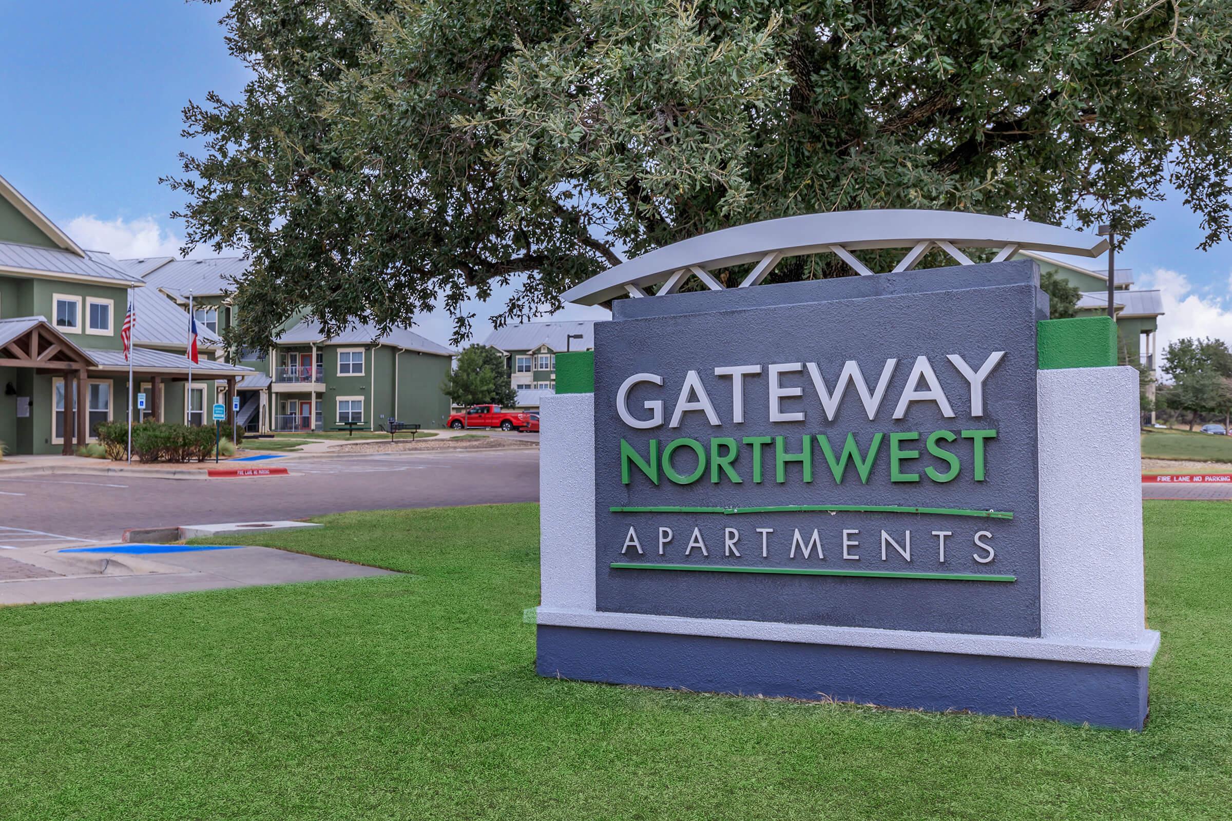 a large lawn in front of a sign