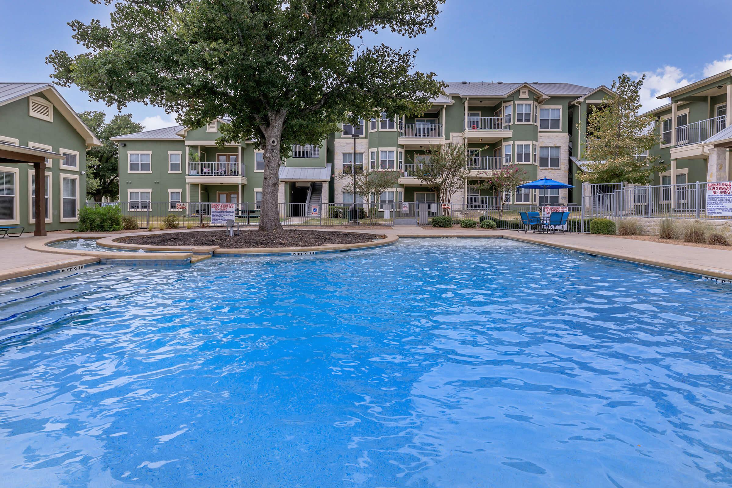 a house with a large pool of water