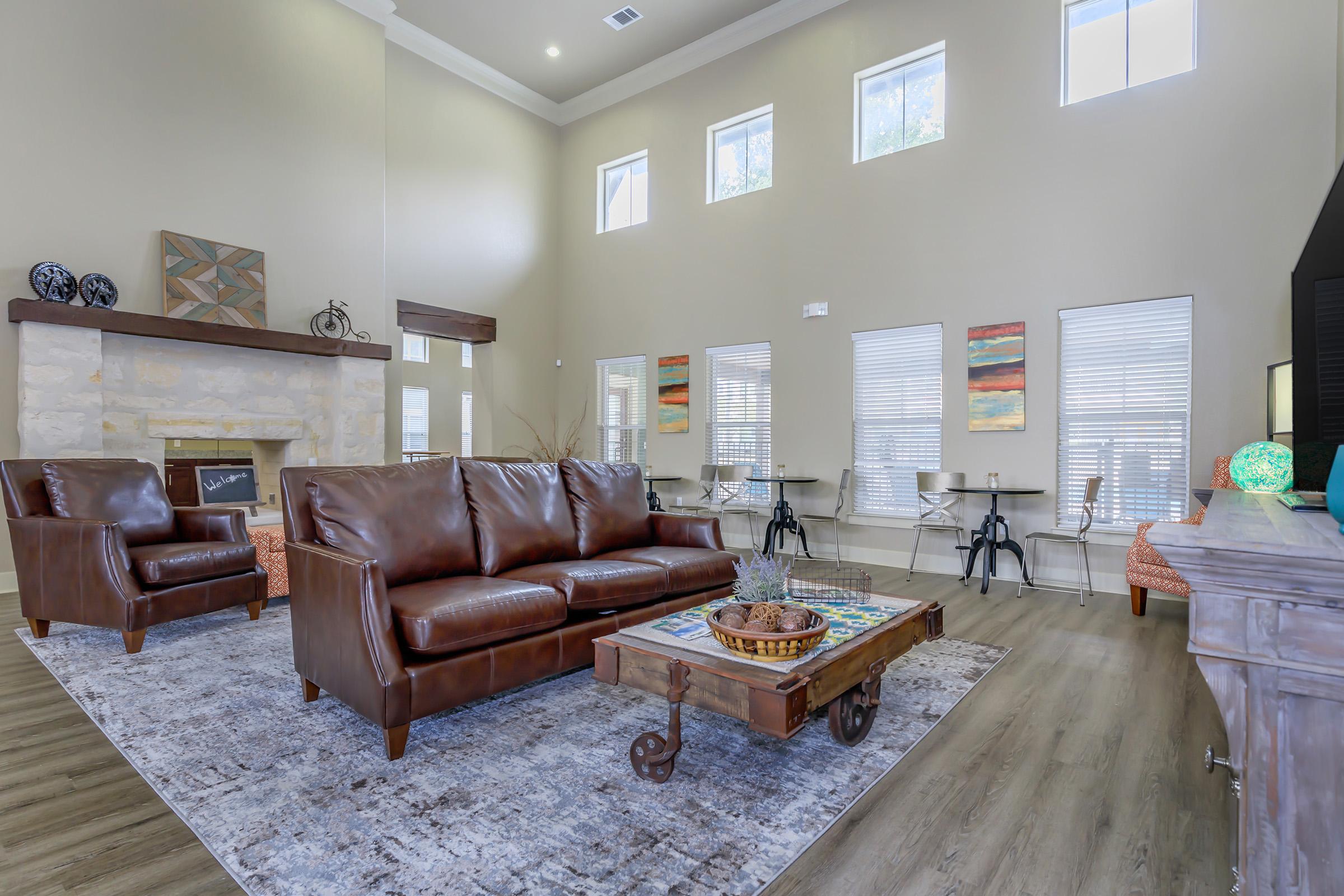 a living room filled with furniture and a fireplace