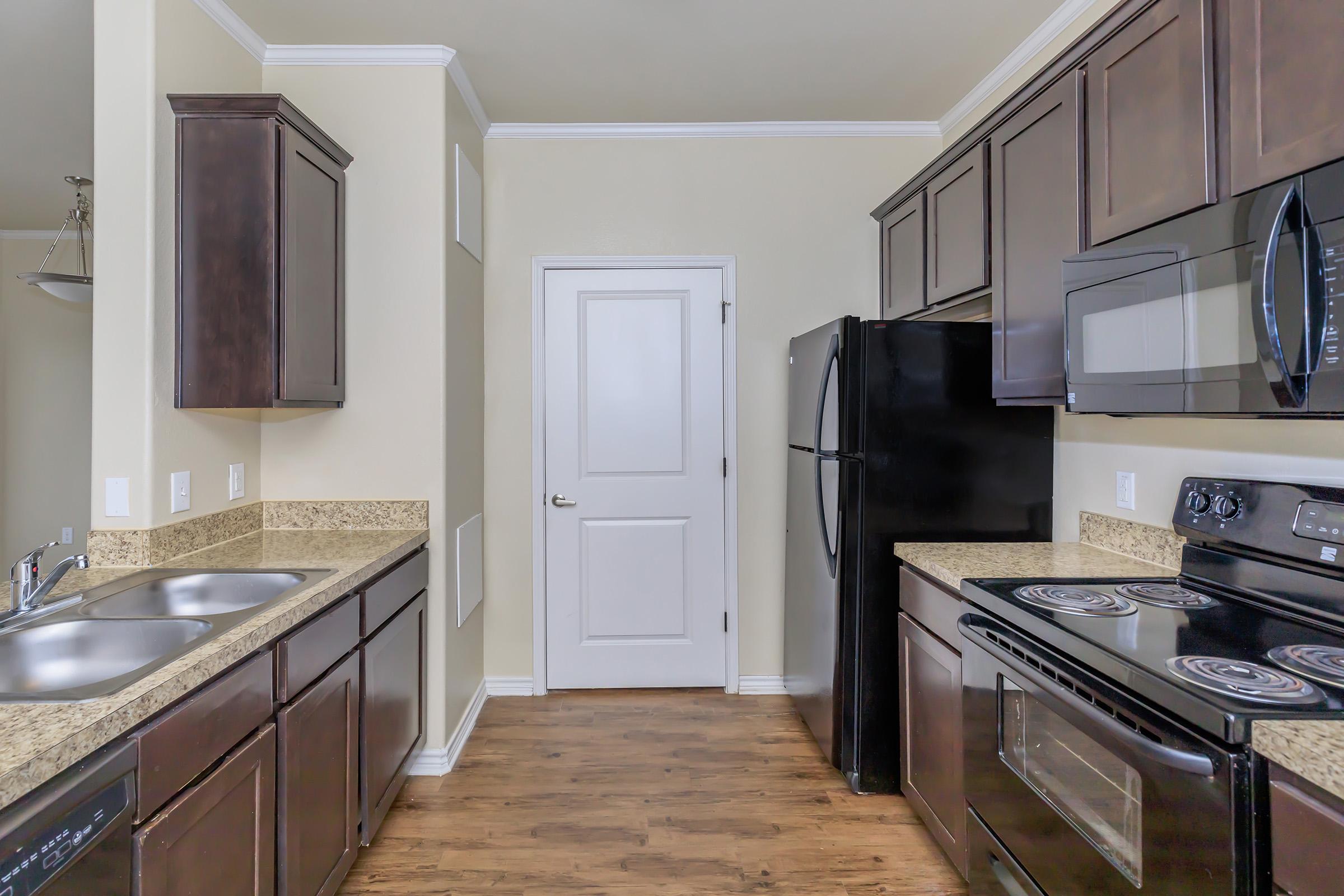 a large kitchen with stainless steel appliances