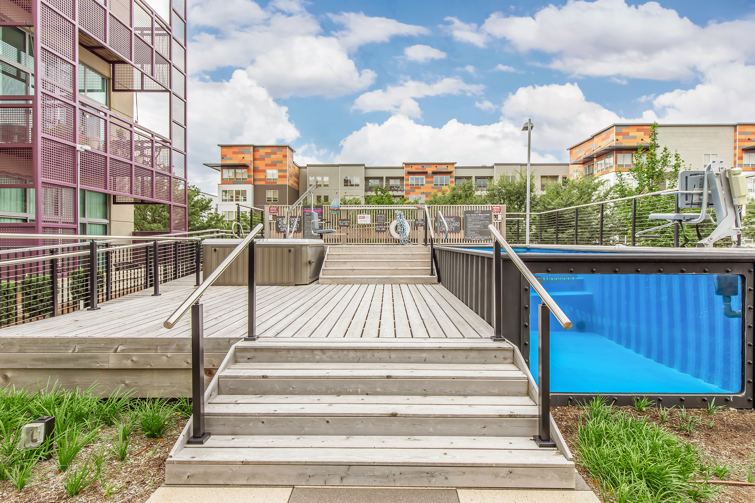 a wooden bench sitting in front of a building