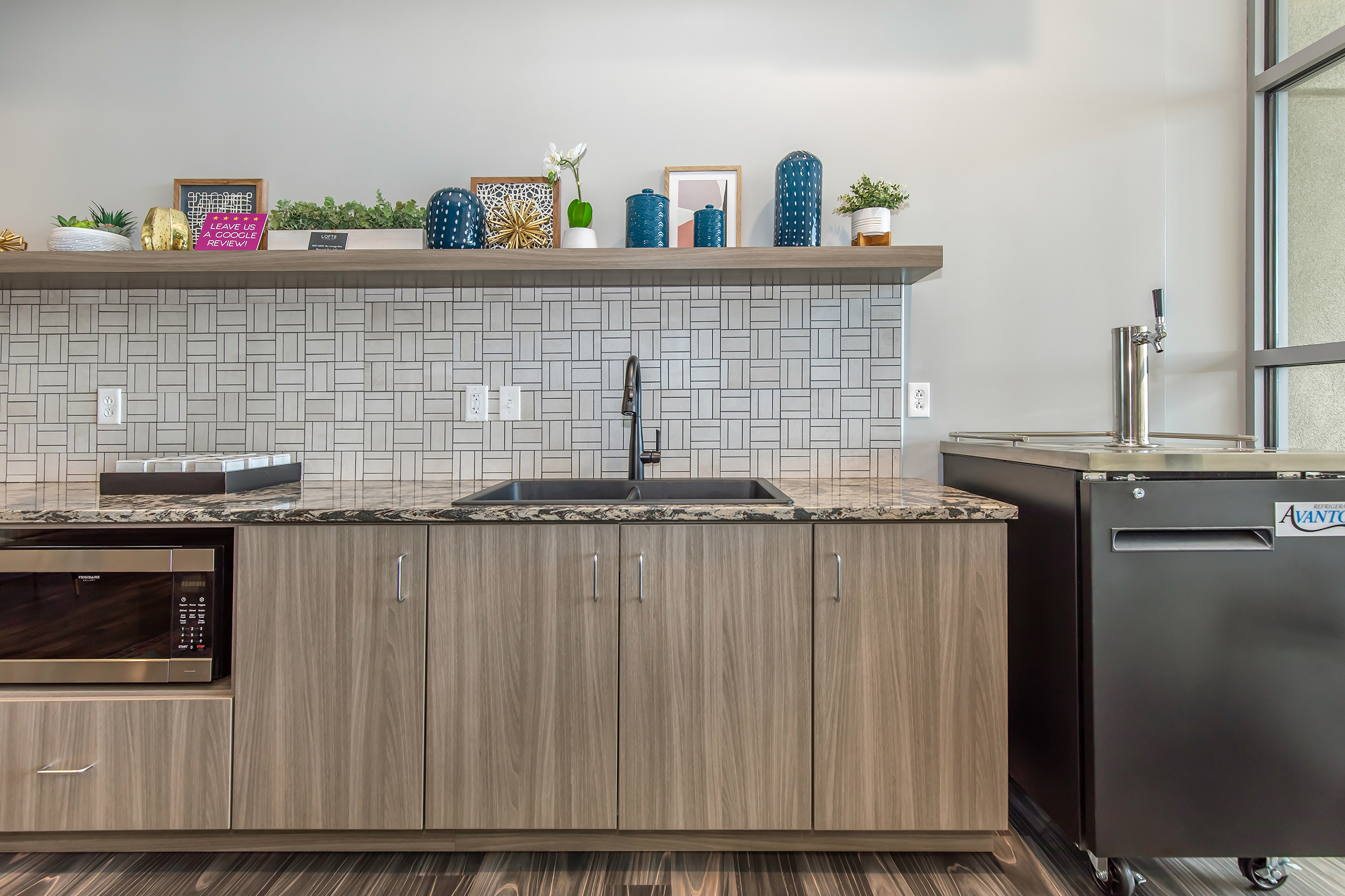 a kitchen with stainless steel appliances and wooden cabinets