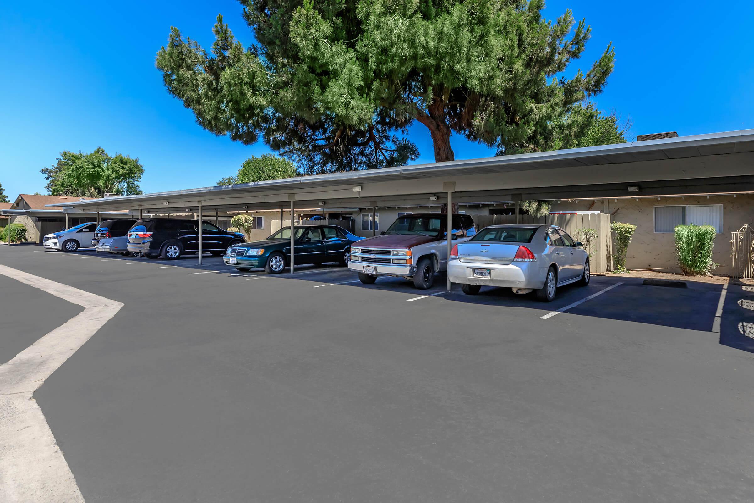 a group of parked cars in a parking lot