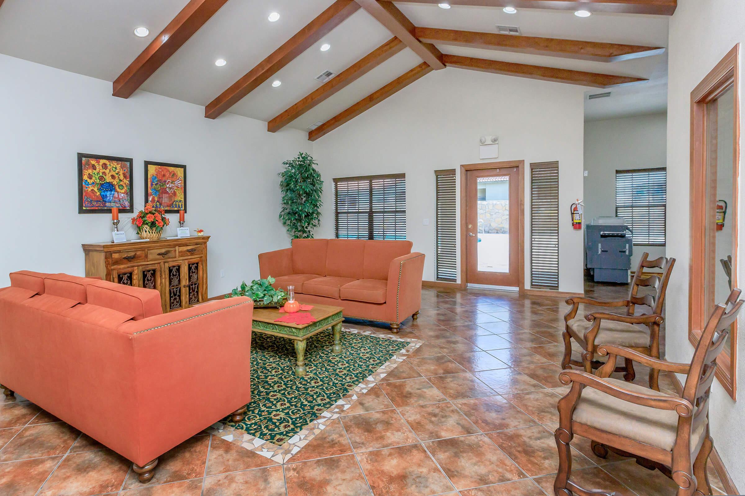 a living room filled with furniture and a fireplace