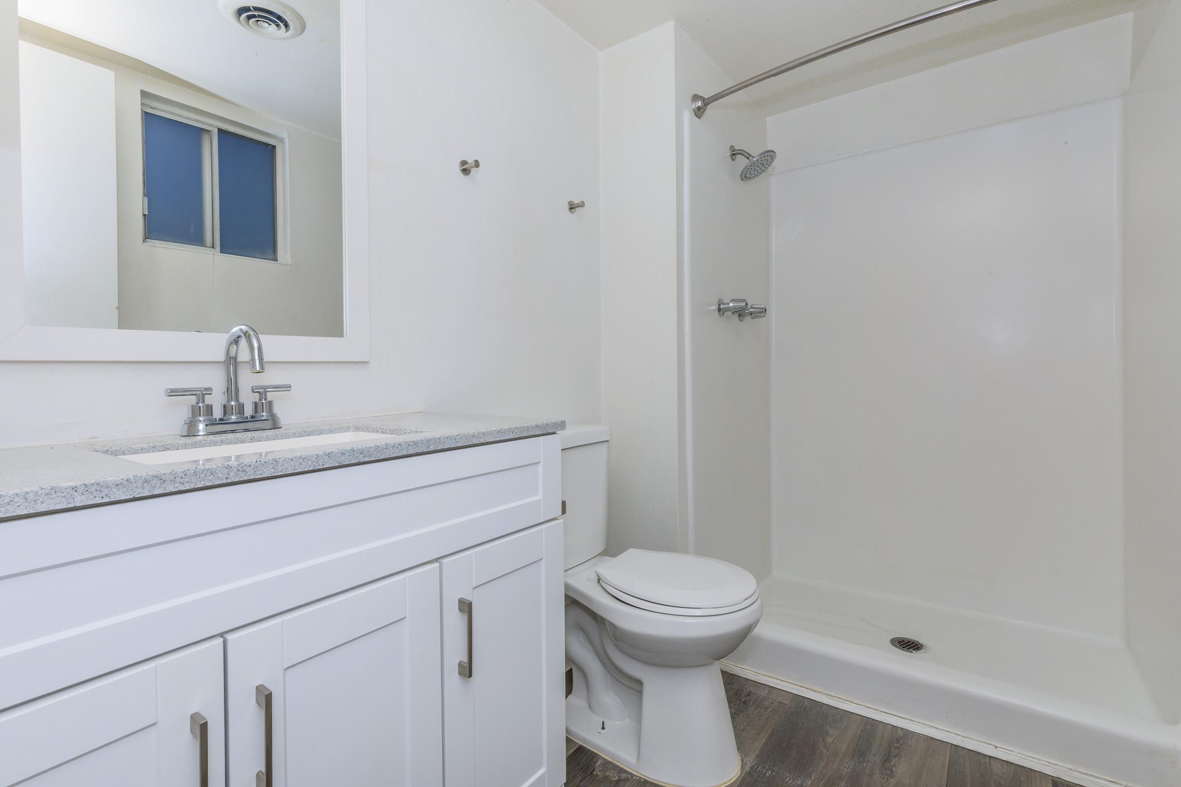 a room with a sink and a mirror