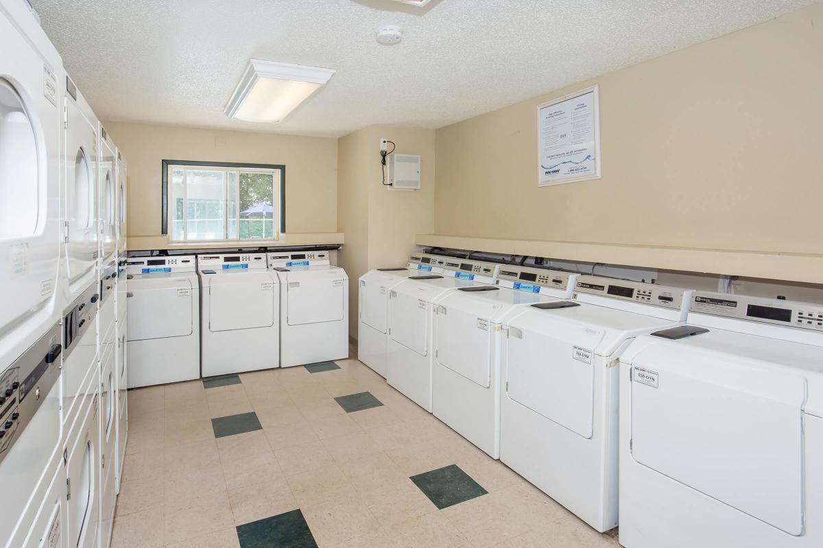 a white refrigerator freezer sitting inside of a kitchen