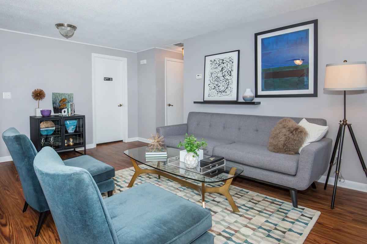 a living room filled with furniture and a flat screen tv