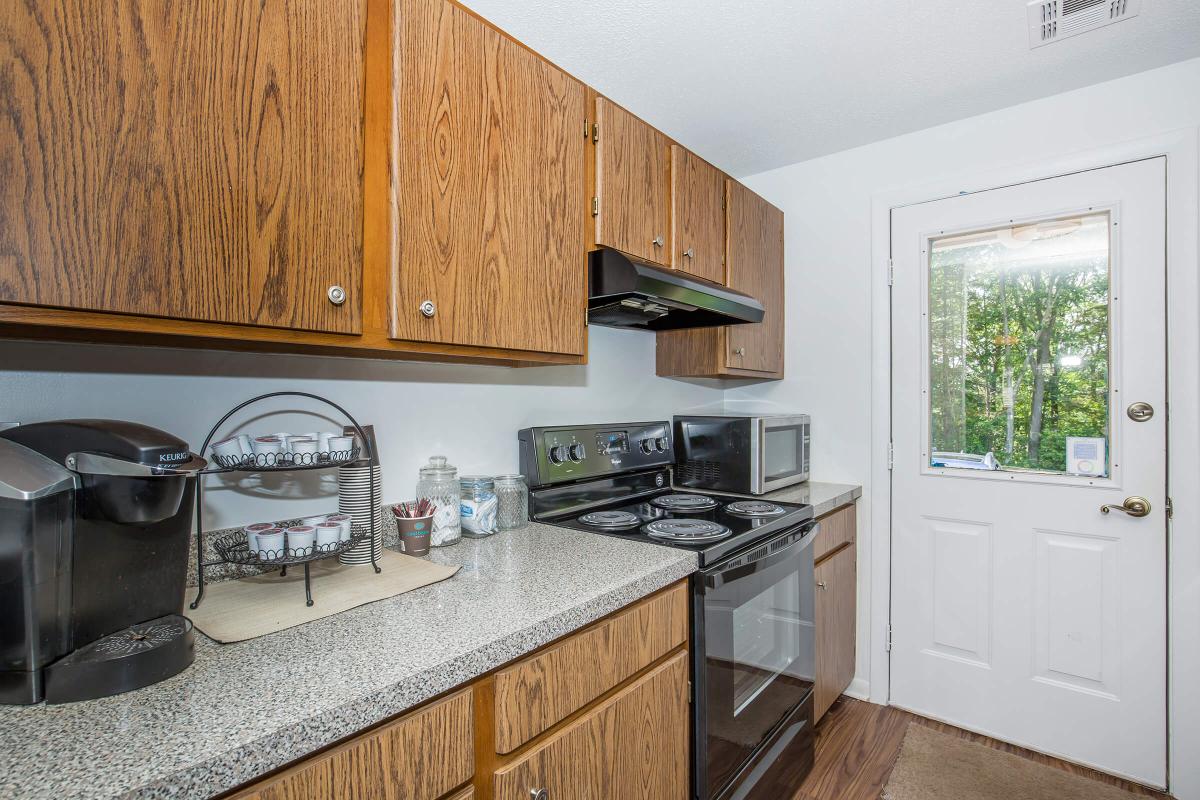 a kitchen with a sink and a window