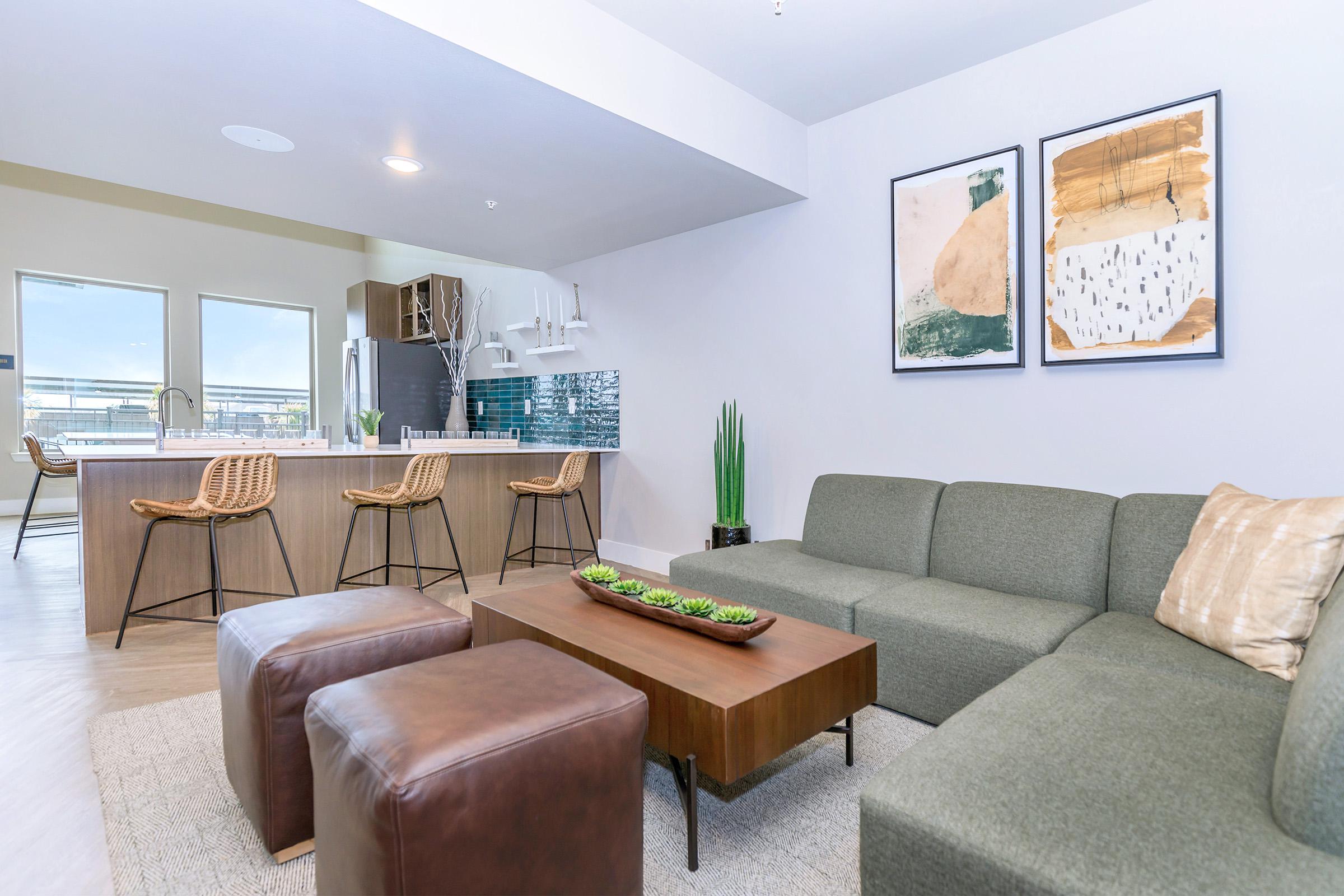 a living room filled with furniture and a large window