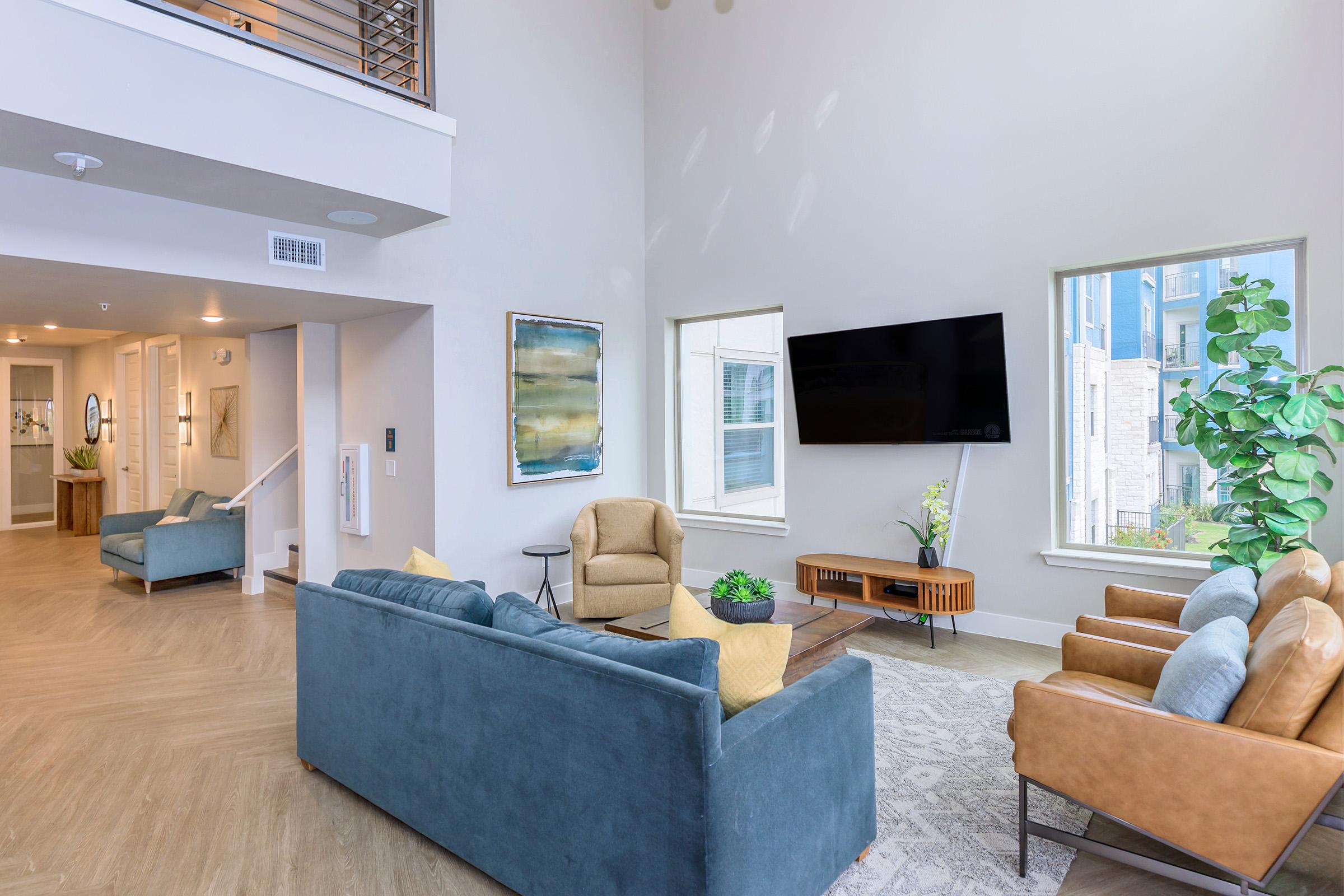 a living room filled with furniture and a fireplace