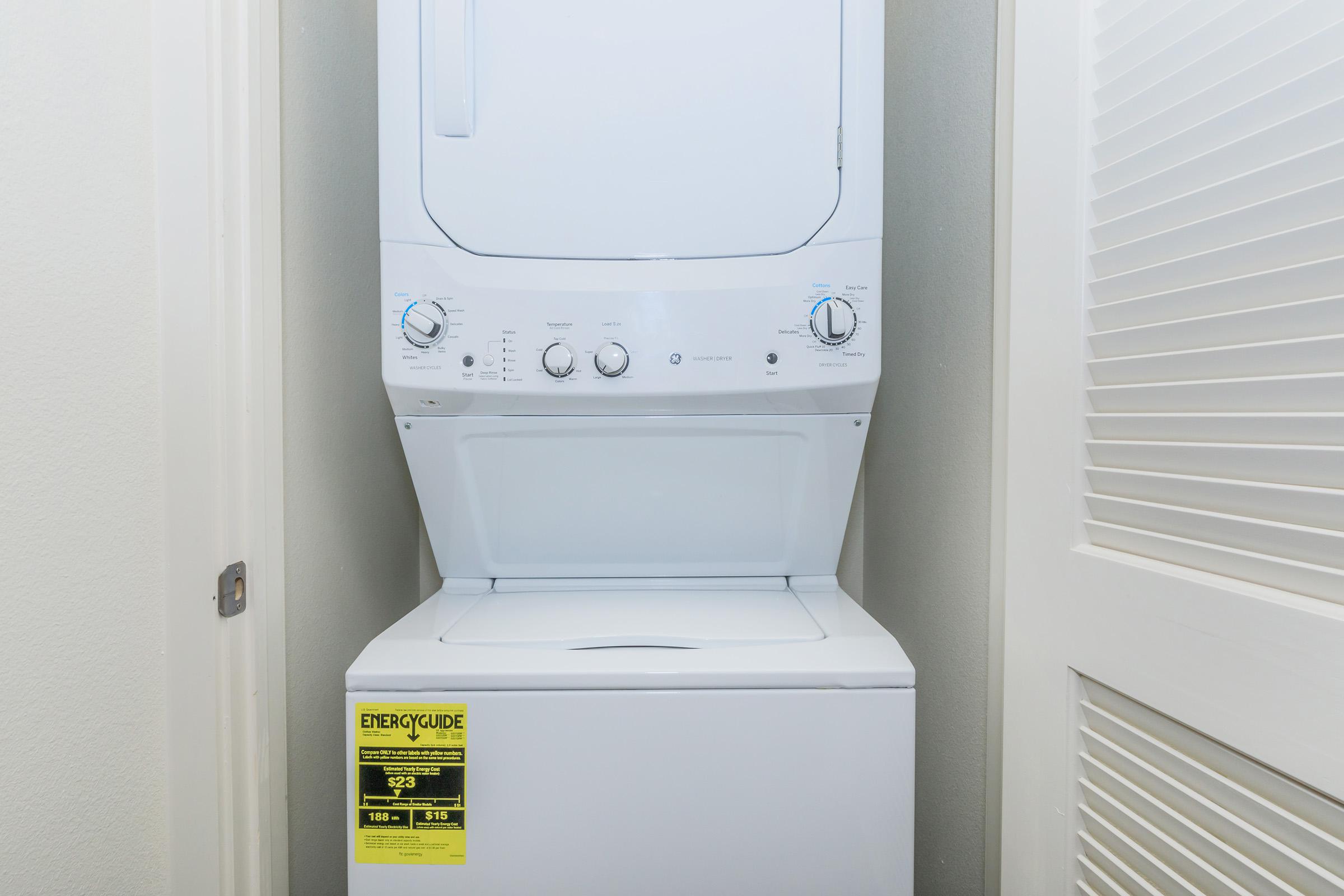 a microwave oven sitting on top of a refrigerator